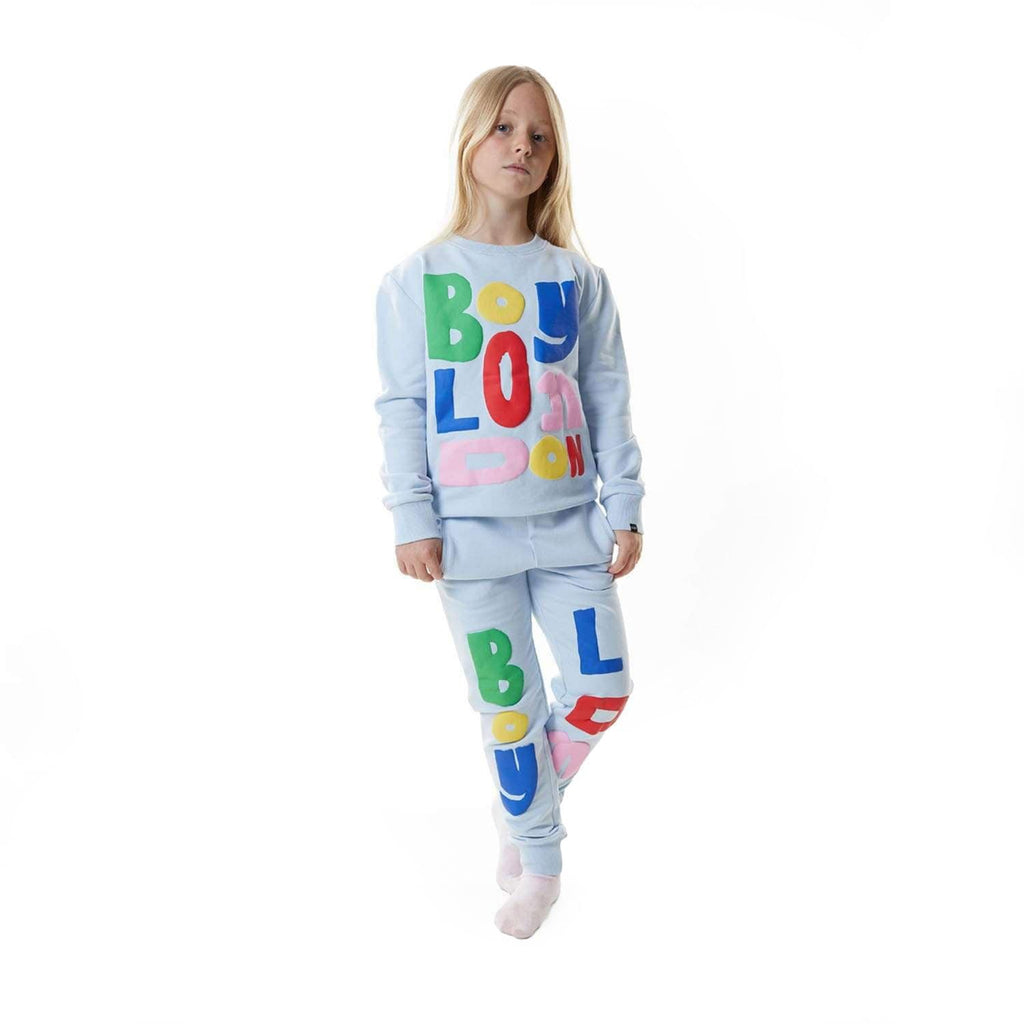 Model wearing BOY London sweatshirt on white background 
