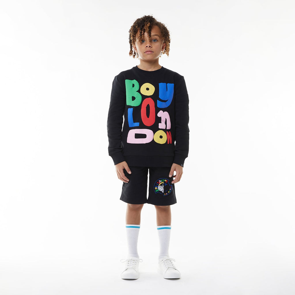 Model wearing BOY London sweatshirt on white background 