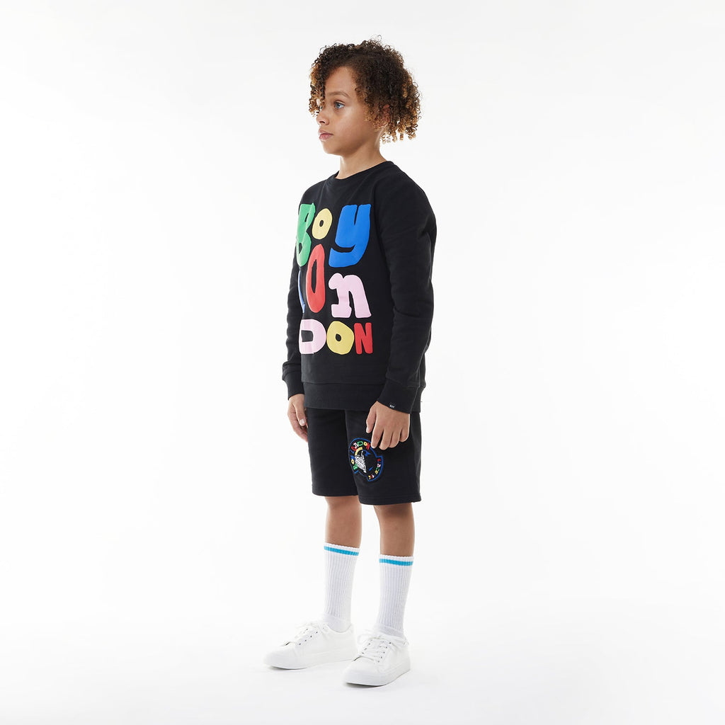 Model wearing BOY London sweatshirt on white background 