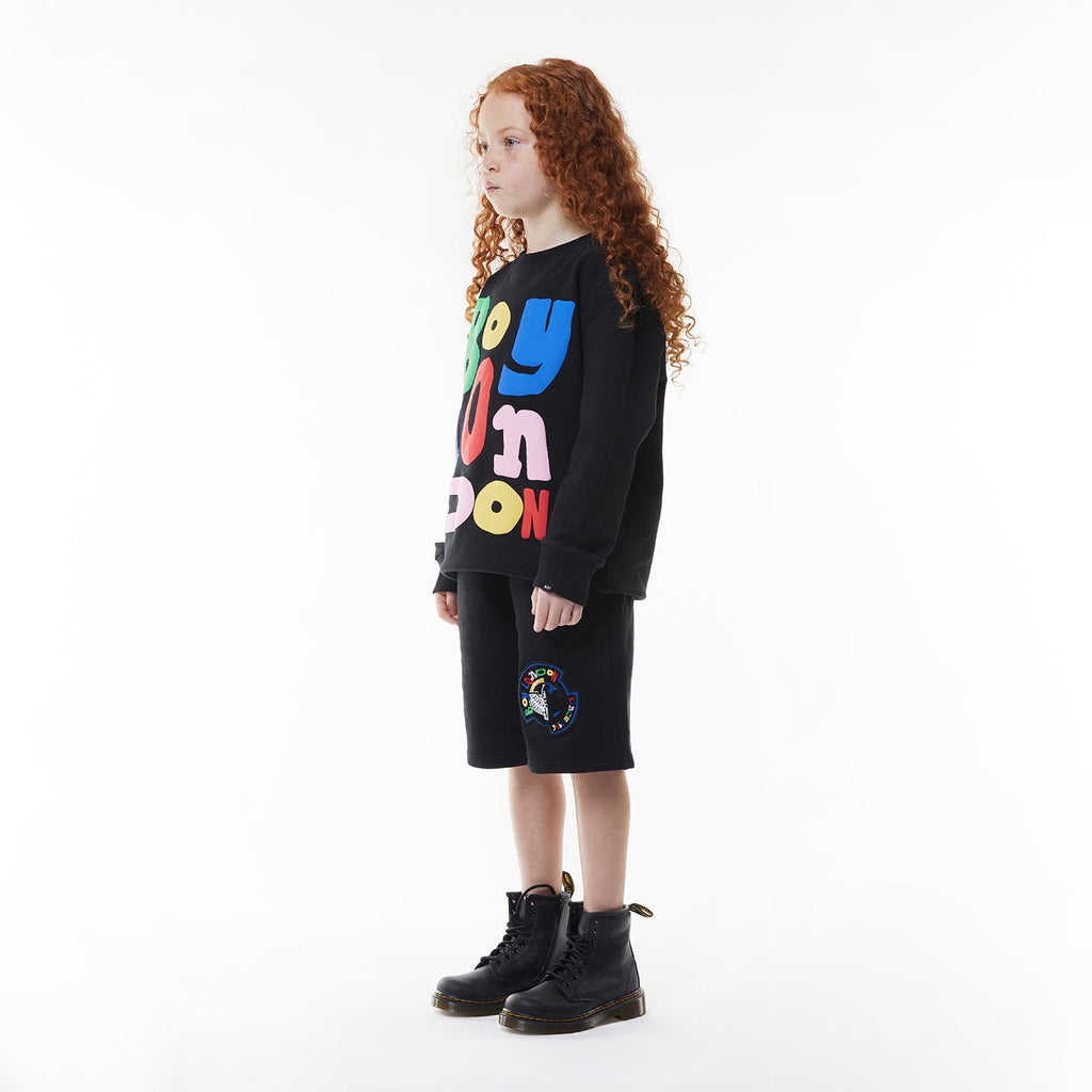Model wearing BOY London sweatshirt on white background 
