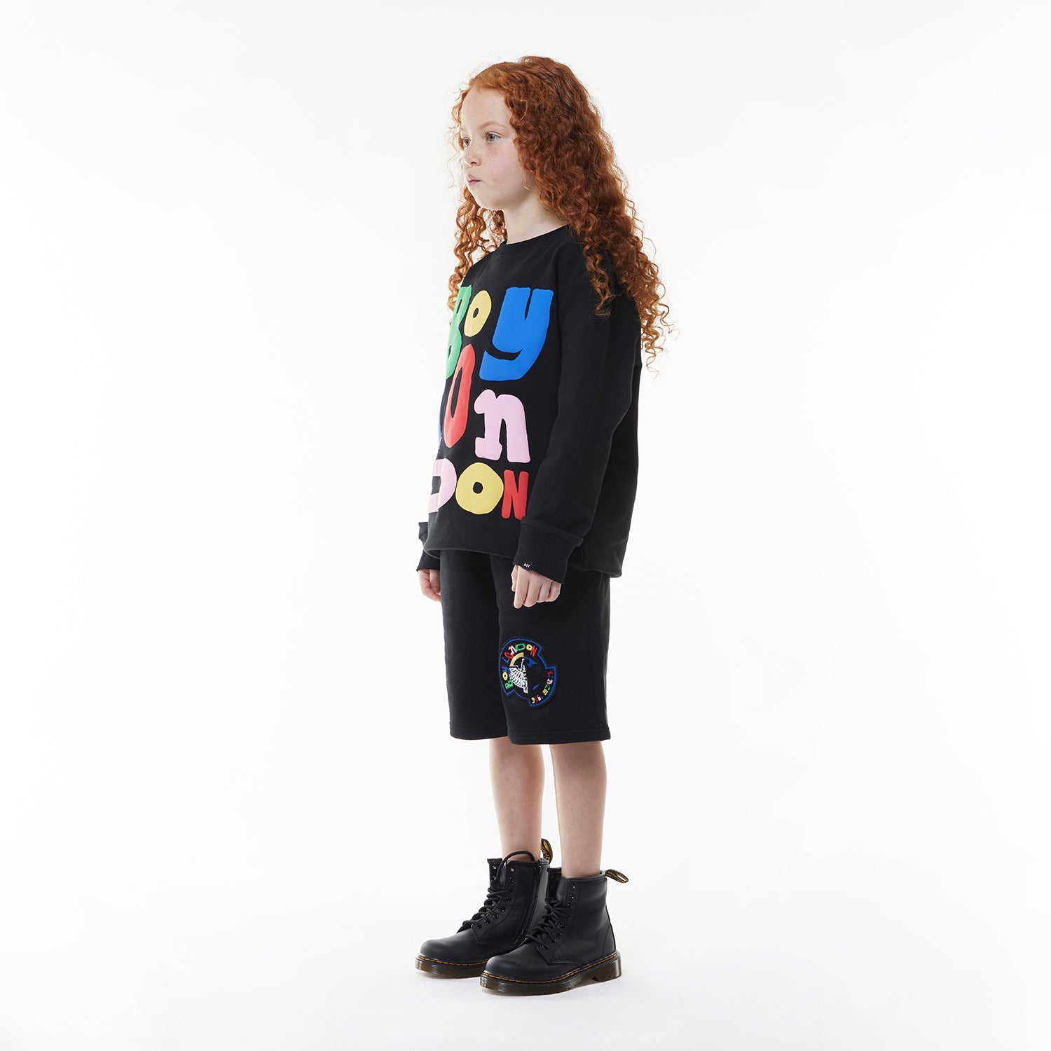 Model wearing BOY London sweatshirt on white background 