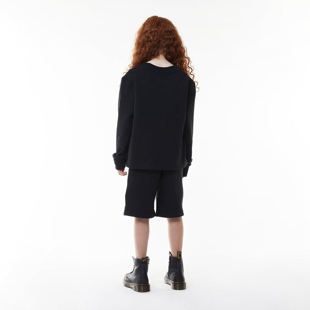 Model wearing BOY London sweatshirt on white background 