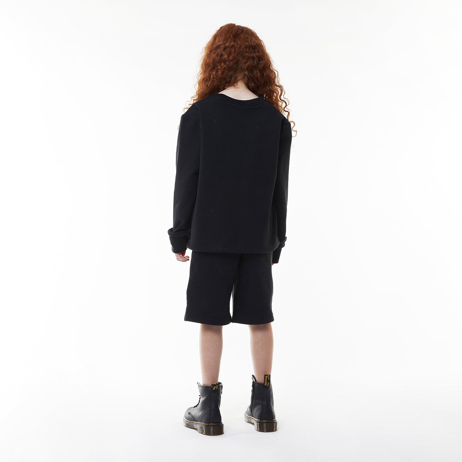 Model wearing BOY London sweatshirt on white background 