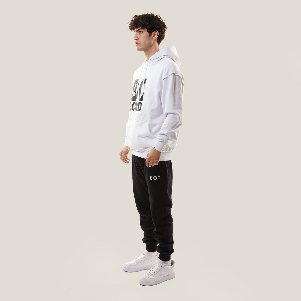 Model wearing White BOY London hoodie with text on a white background