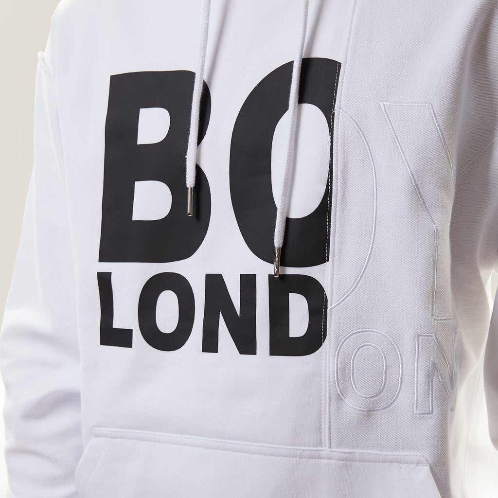 Model wearing White BOY London hoodie with text on a white background