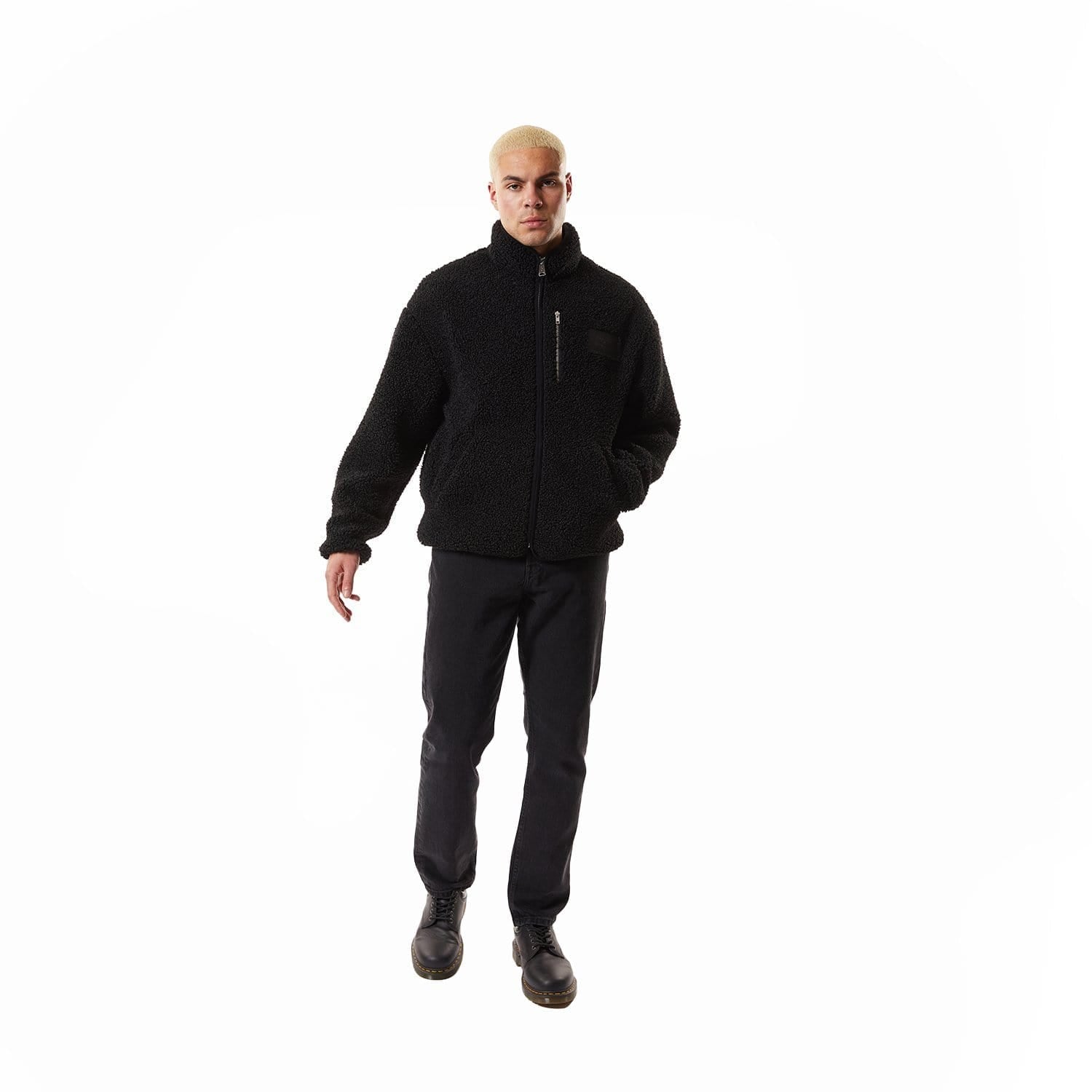 Model wearing Black BOY London fleece jacket with a brand logo on a white background