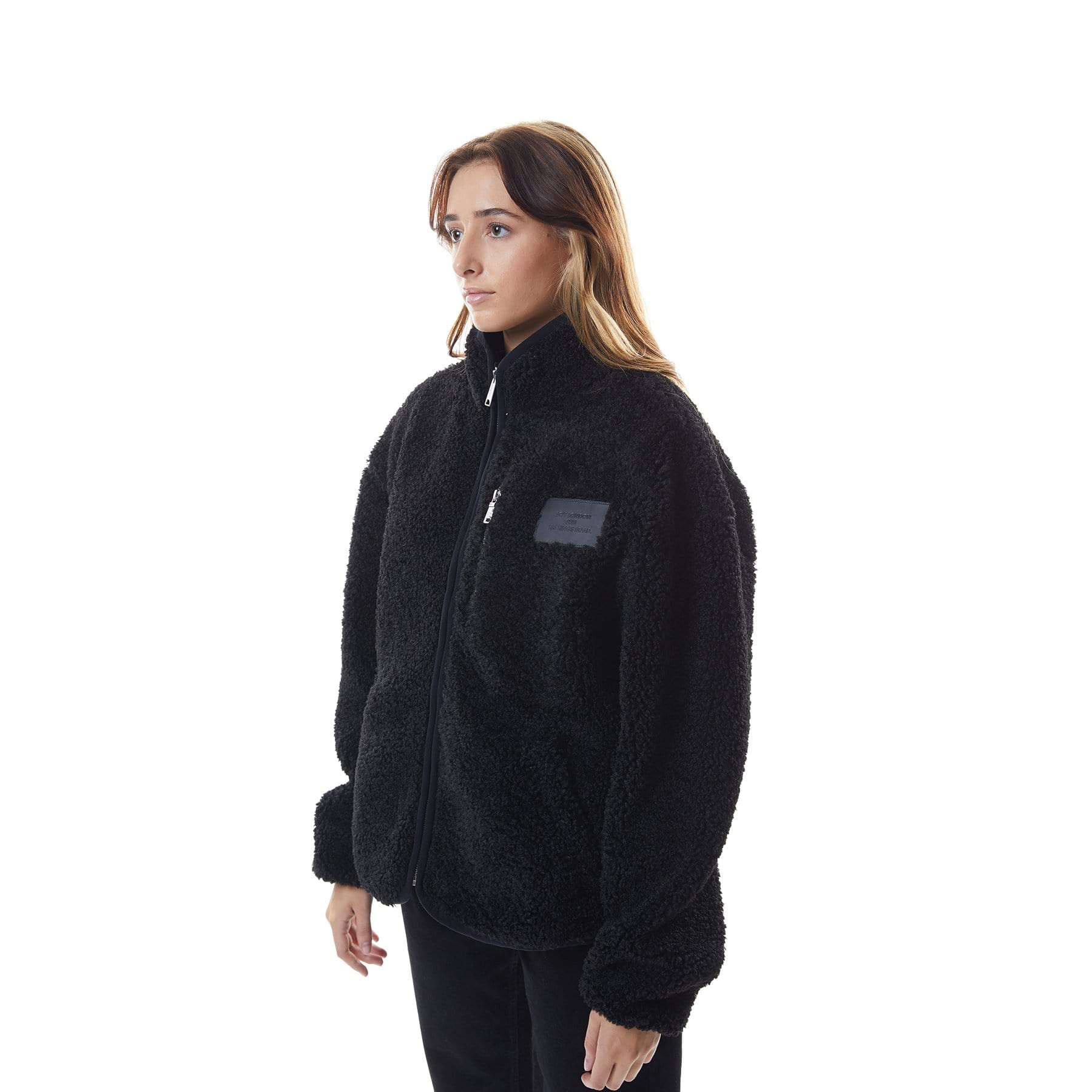 Model wearing Black BOY London fleece jacket with a brand logo on a white background