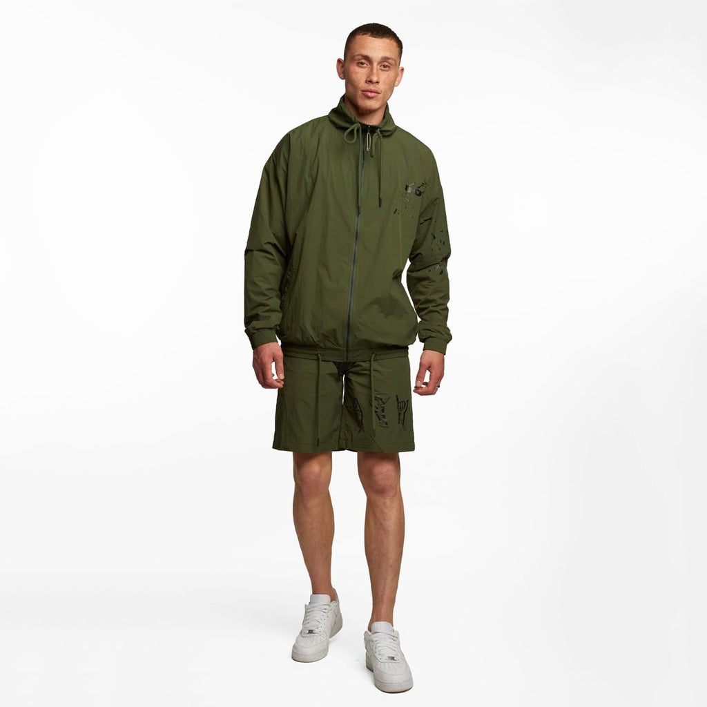 Model wearing BOY London shorts on white background