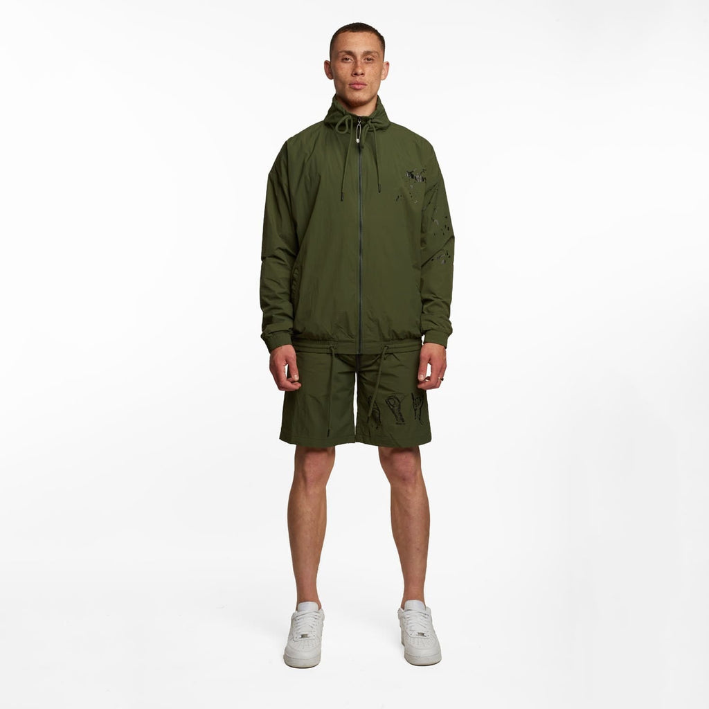 Model wearing BOY London shorts on white background
