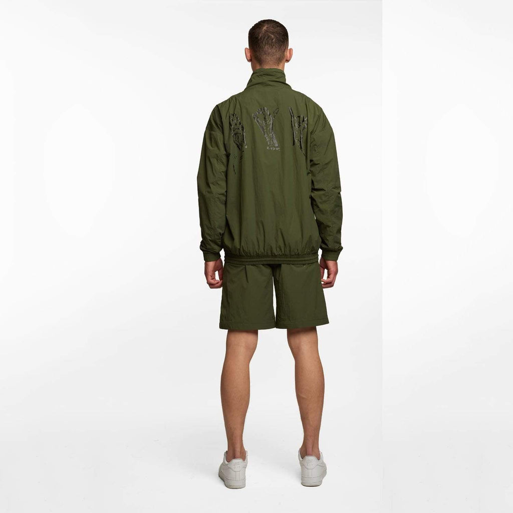 Model wearing BOY London shorts on white background