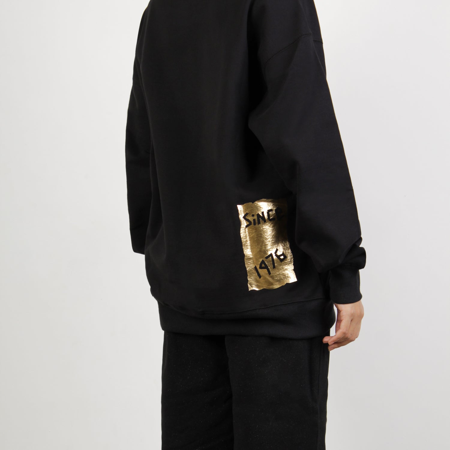 model wearing BOY London on white background 