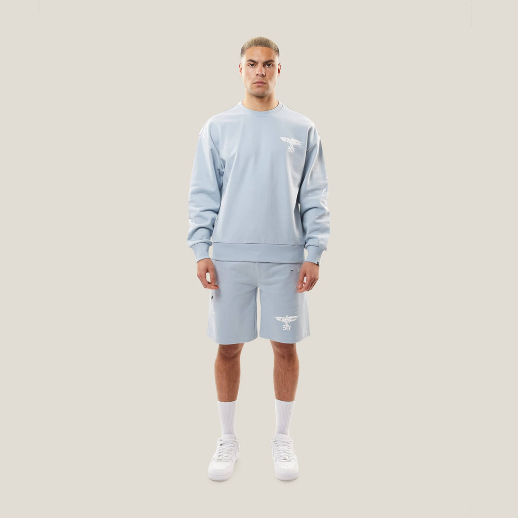 Model wearing boy london shorts on white background