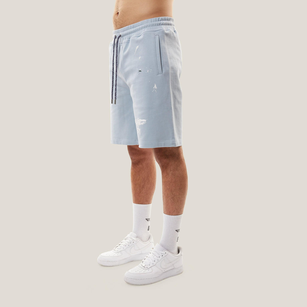 Model wearing boy london shorts on white background