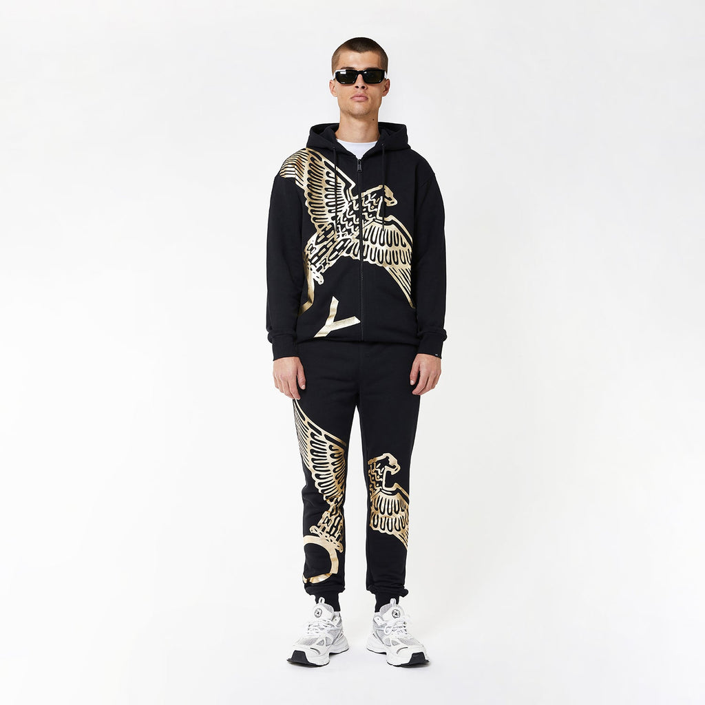 Model wearing BOY London joggers on white background