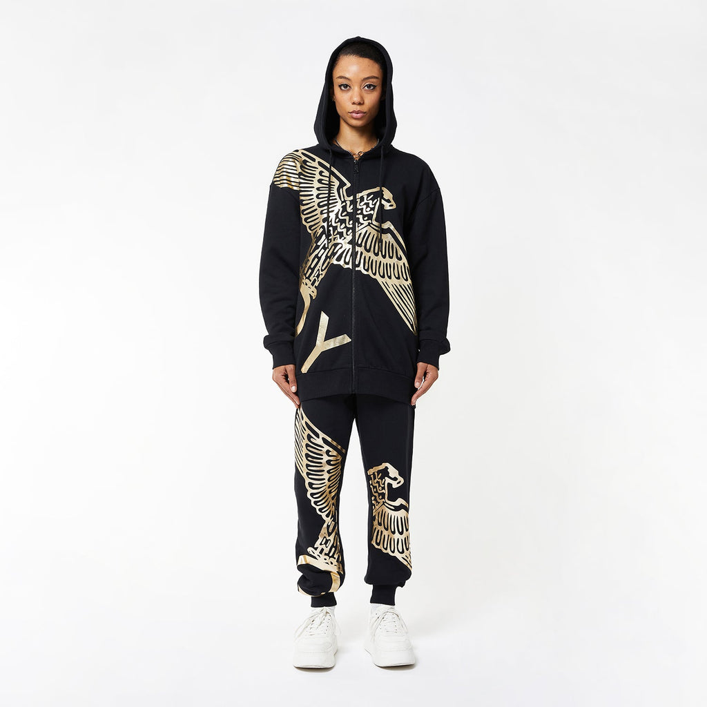 Model wearing BOY London joggers on white background