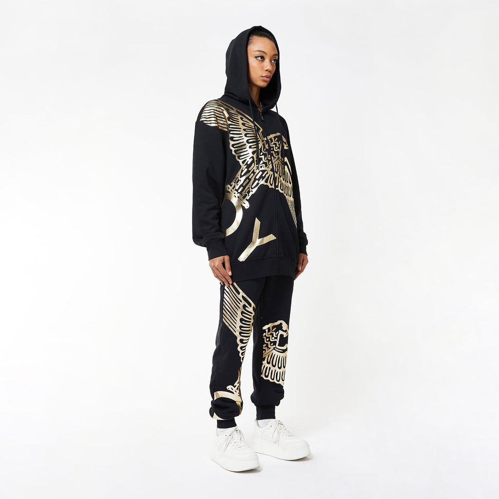Model wearing BOY London joggers on white background