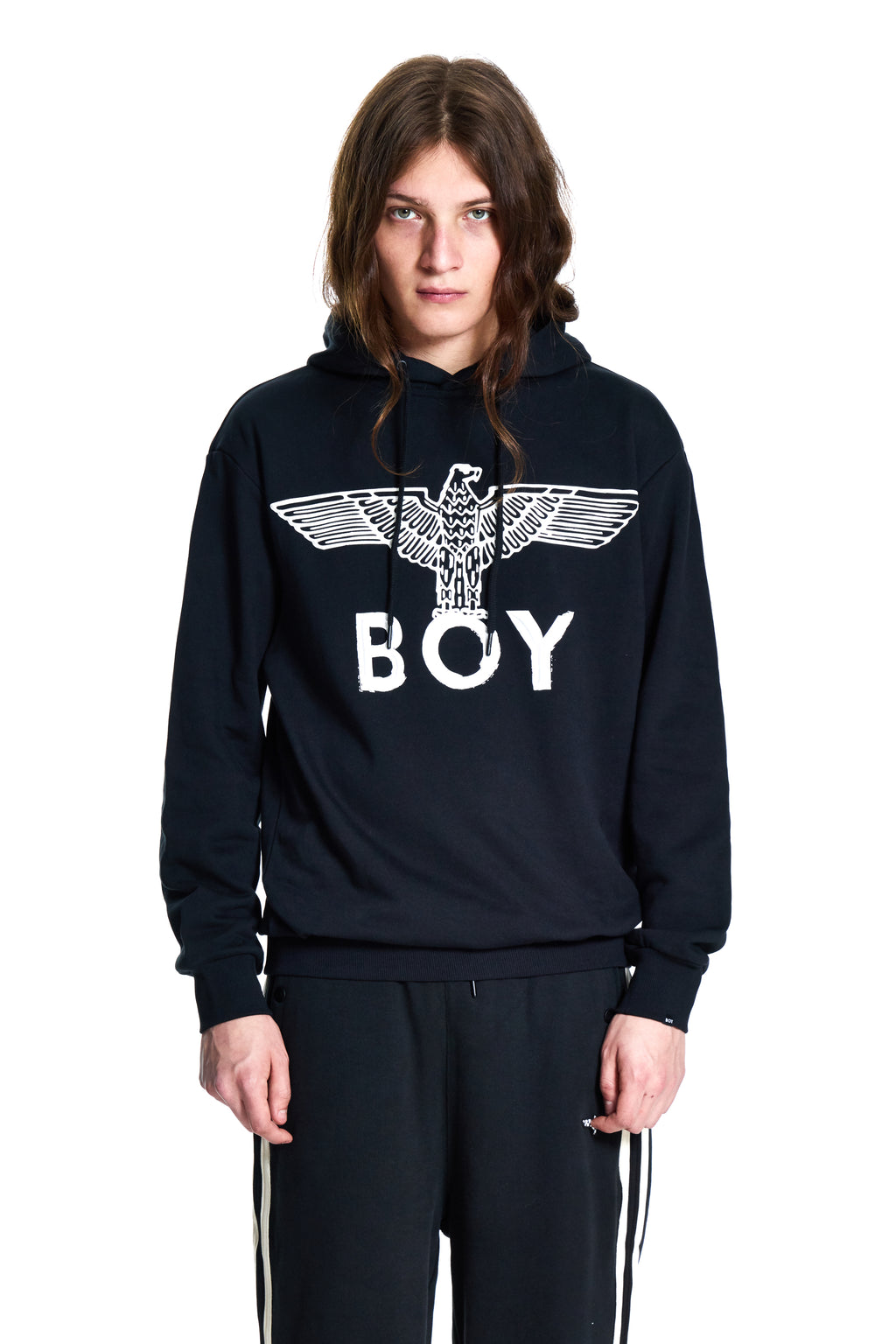 Person wearing a black hoodie with 'BOY' London and an eagle design on a white background