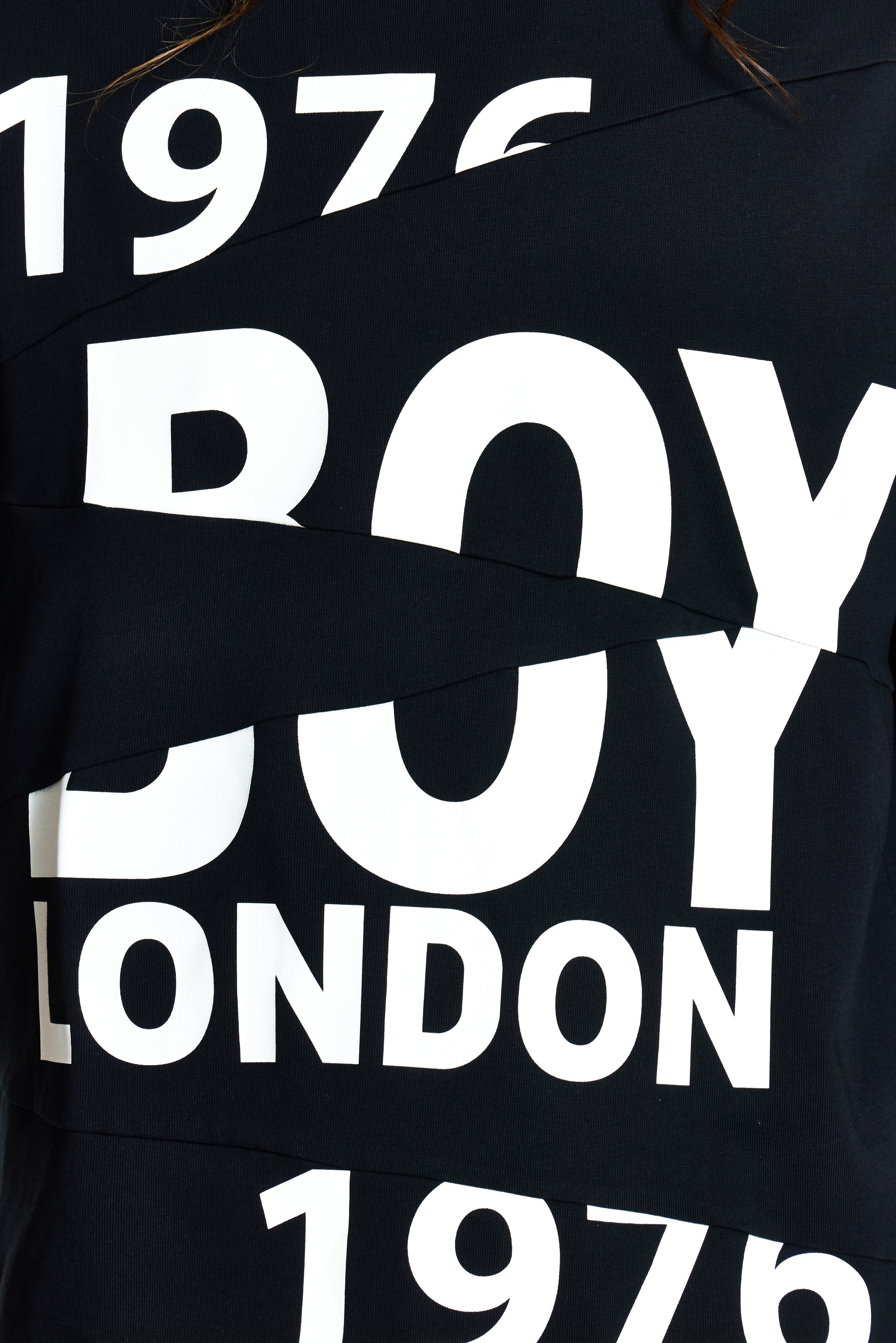 Black t-shirt with 'BOY LONDON 1976' text in white on a dark background