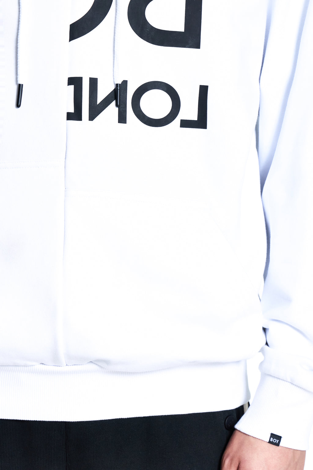 Model wearing White BOY London  hoodie with black text 