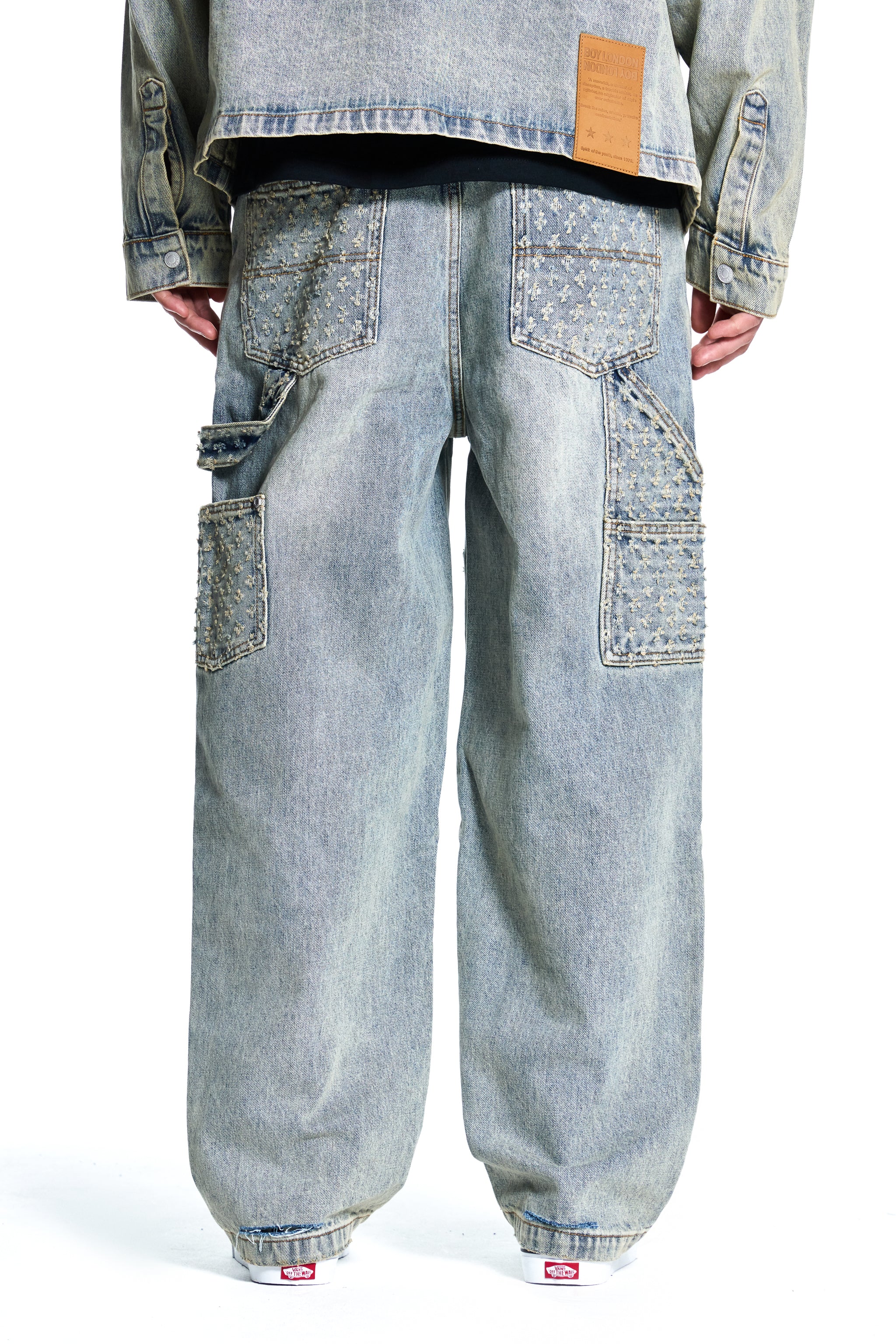 LASER DISTRESSED DENIM TROUSERS