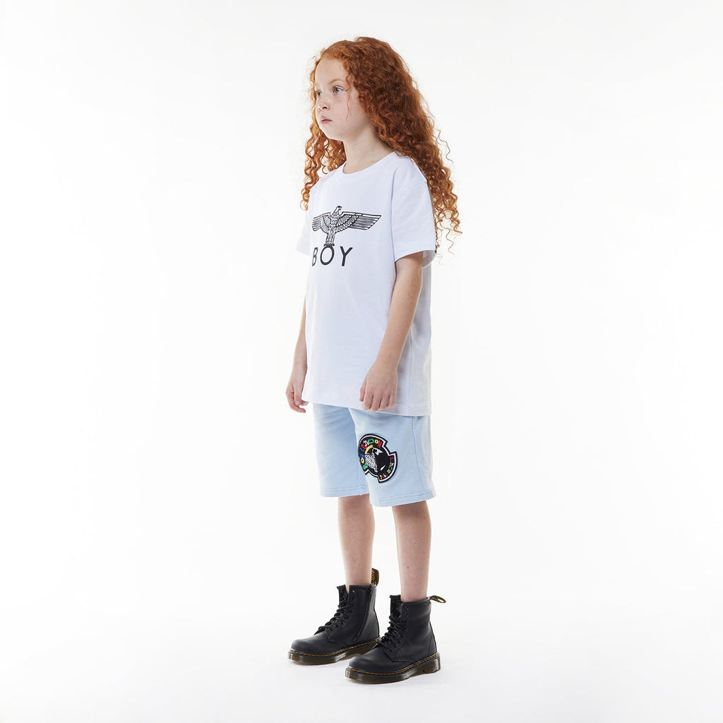 Model wearing BOY London shorts on white background