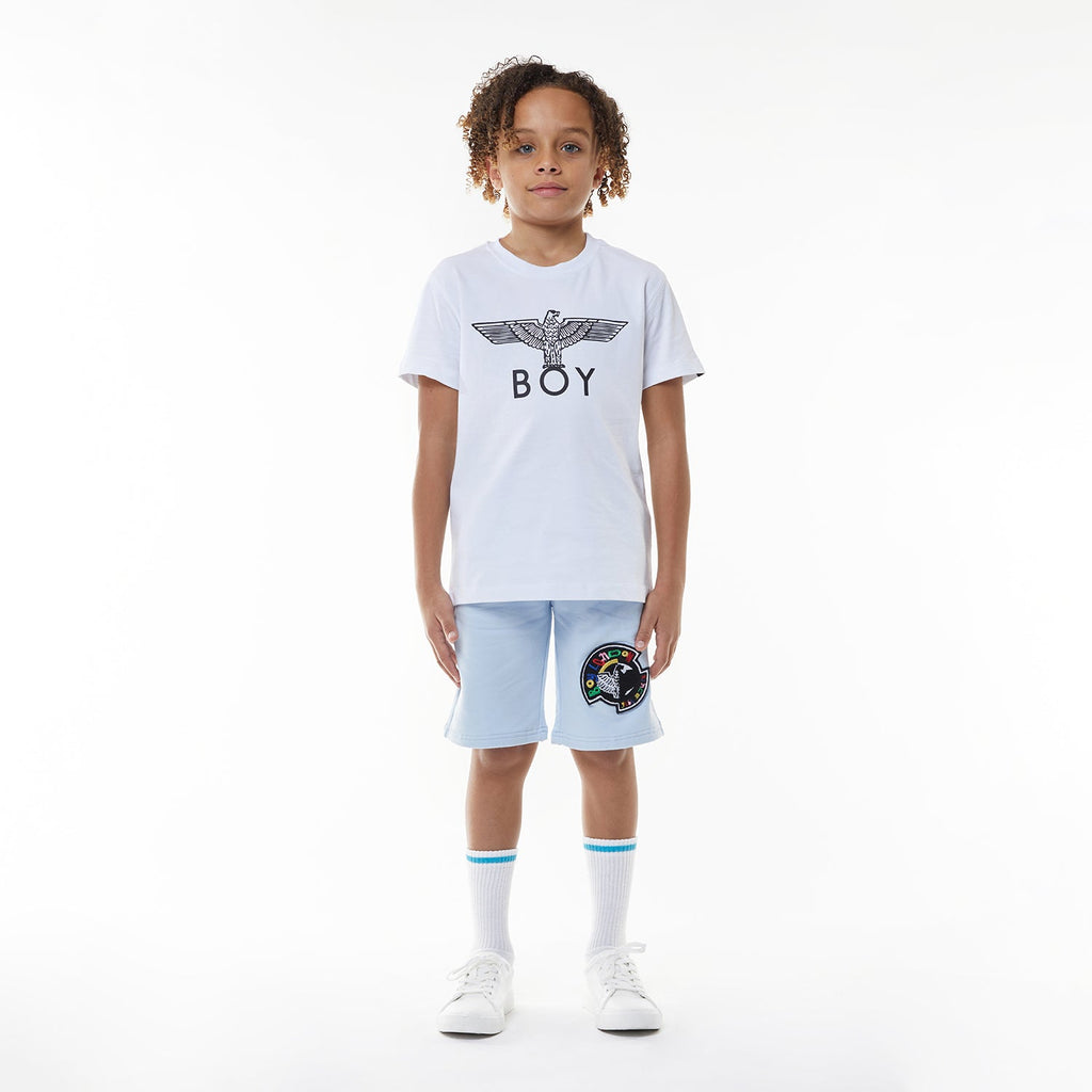Model wearing BOY London shorts on white background