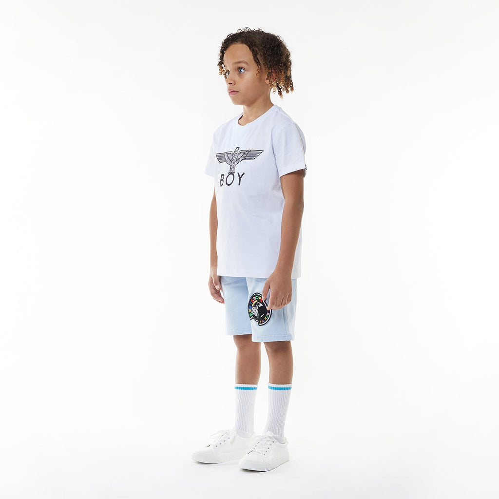 Model wearing BOY London shorts on white background