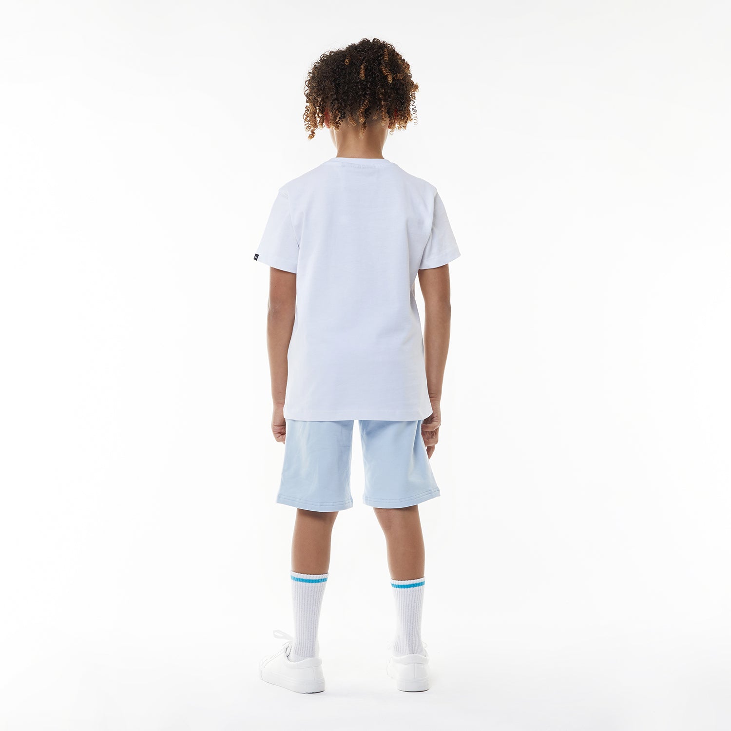 Model wearing BOY London shorts on white background