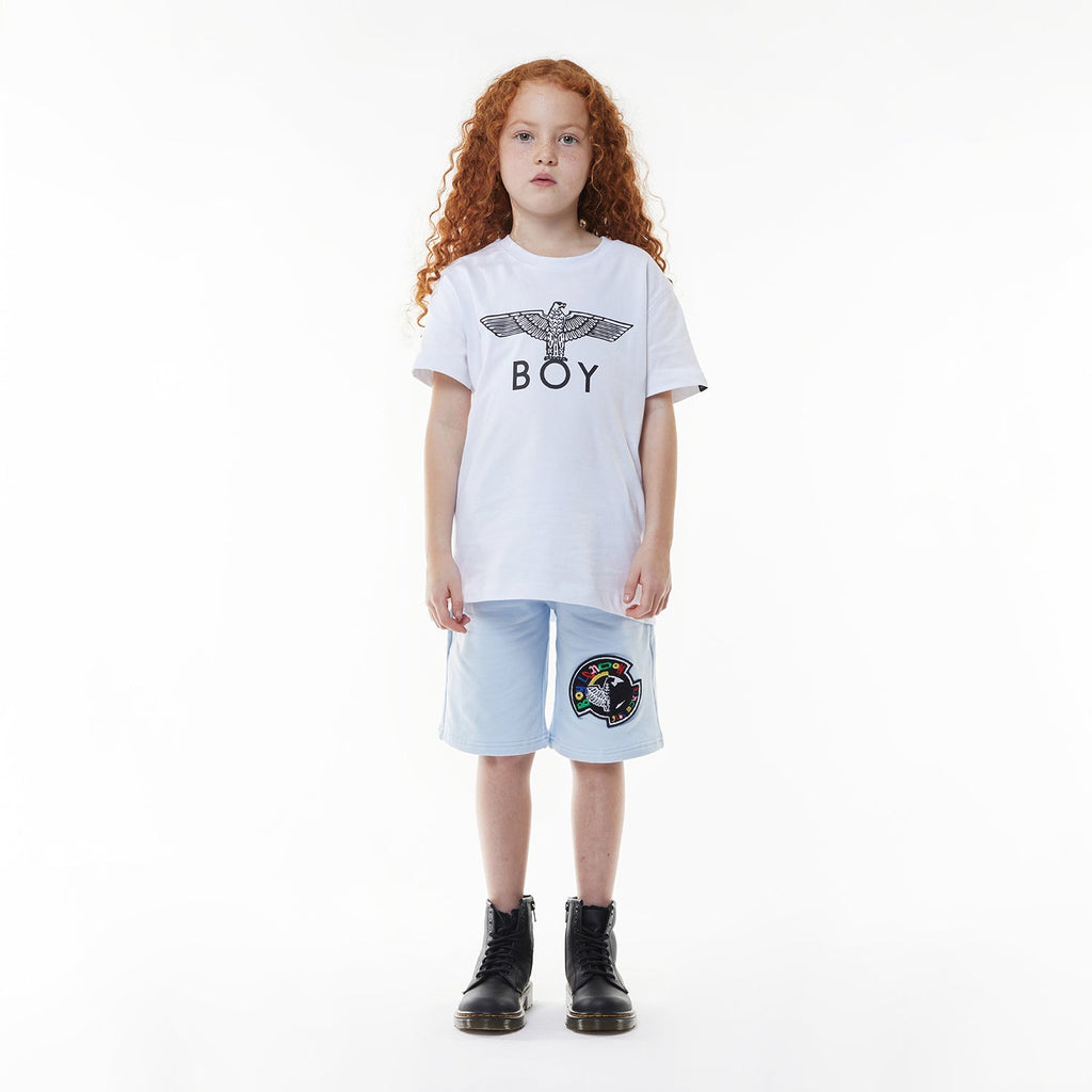 Model wearing BOY London shorts on white background