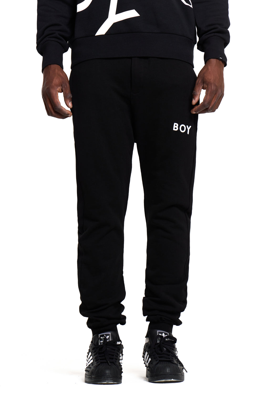 Black sweatpants with 'BOY' London branding on a white background