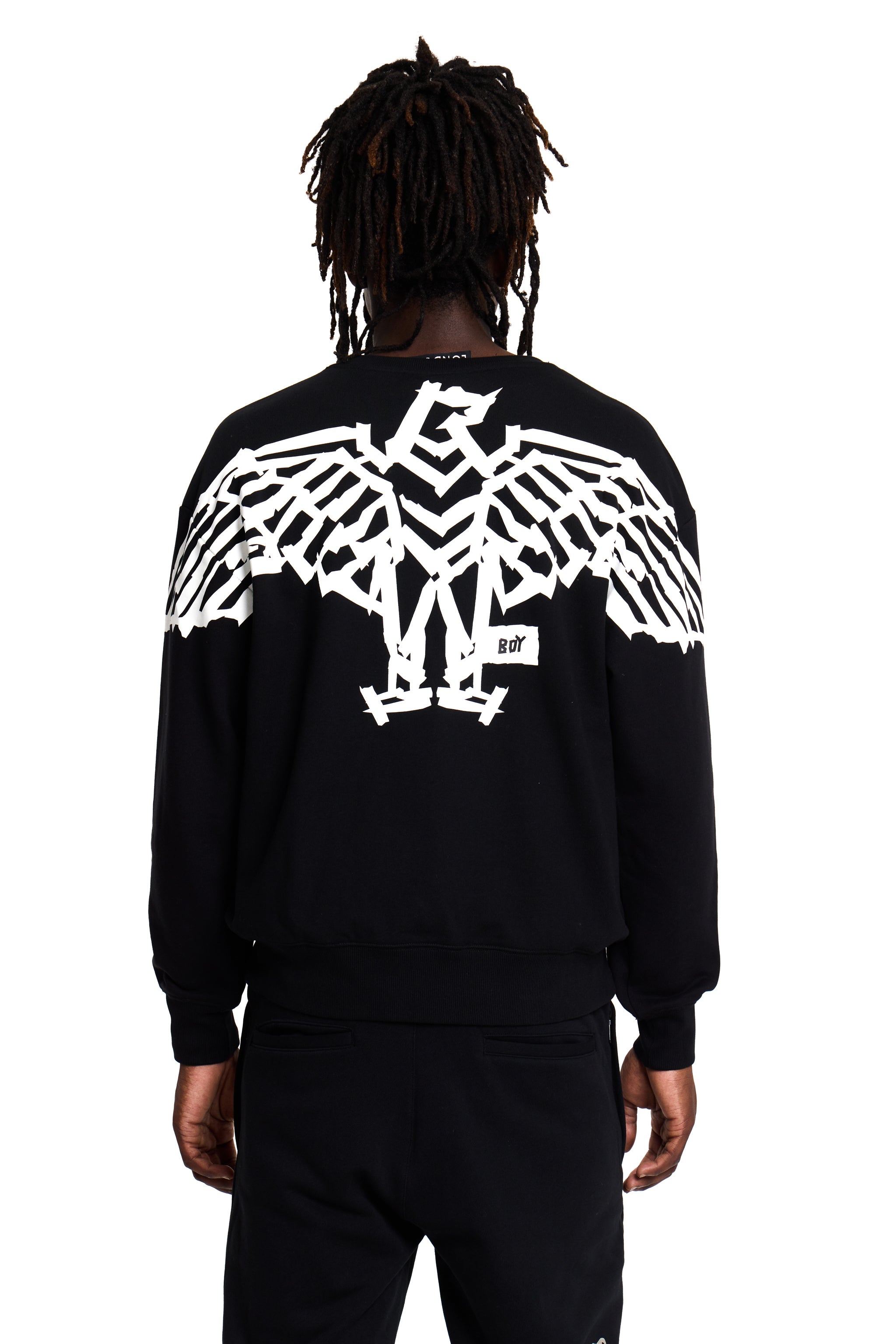 Model wearing a black BOY London sweatshirt with a white eagle design on the back against a white background