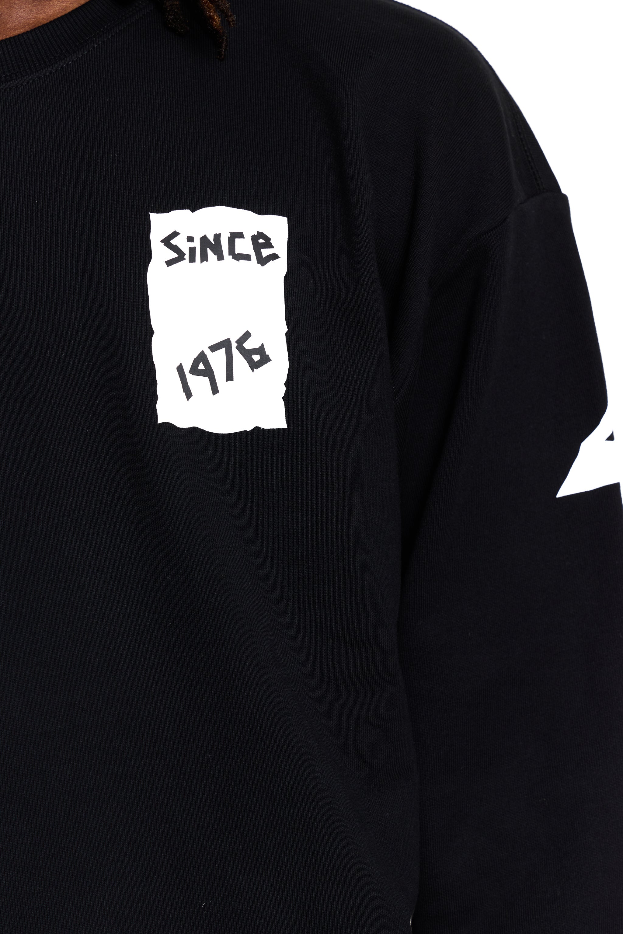 Black BOY London sweatshirt with white graphic design on a white background