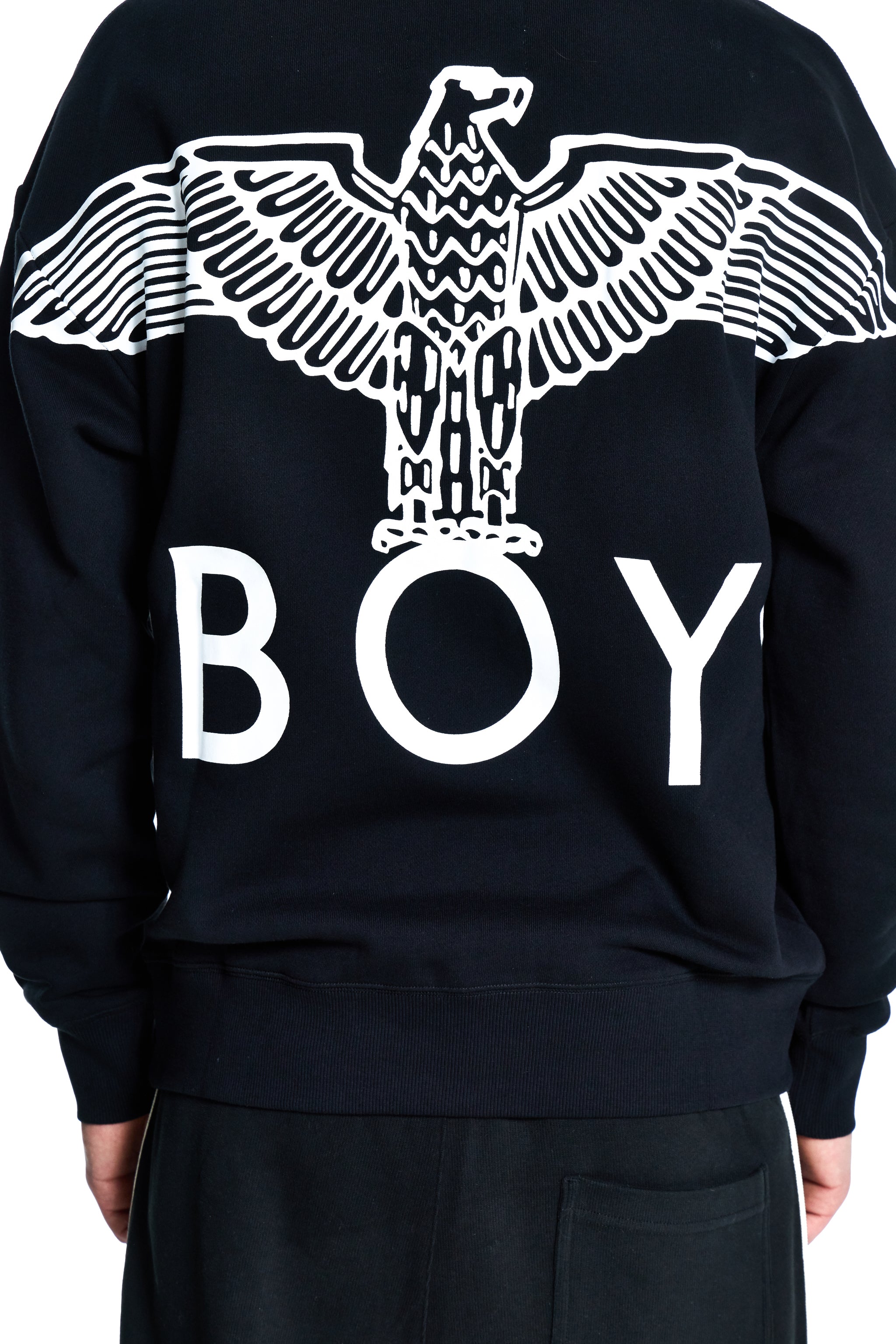 Black sweatshirt with white eagle design and 'BOY' text on the back