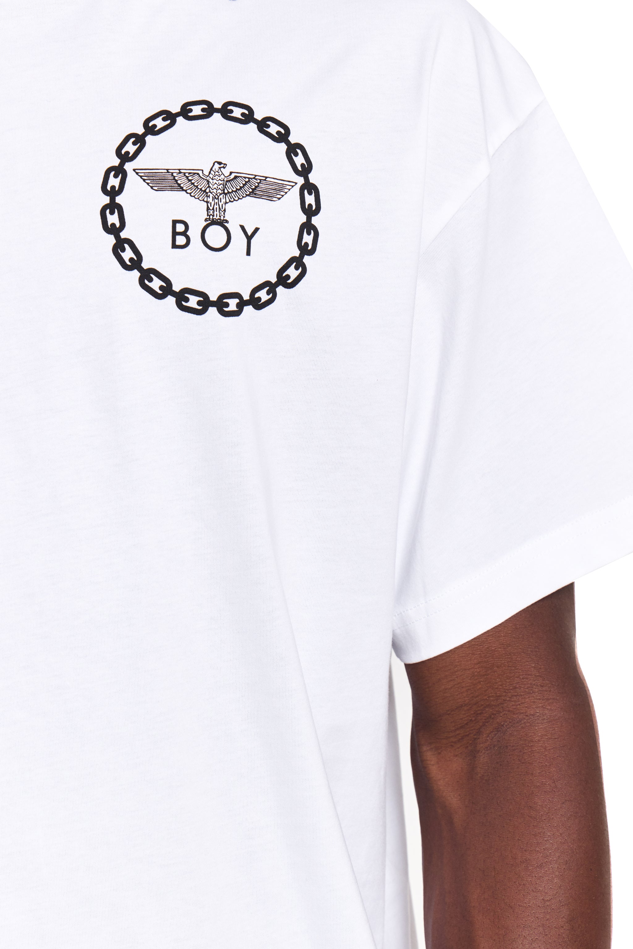 Model wearing White t-shirt with brown side panel and 'BOY' London logo on a white background
