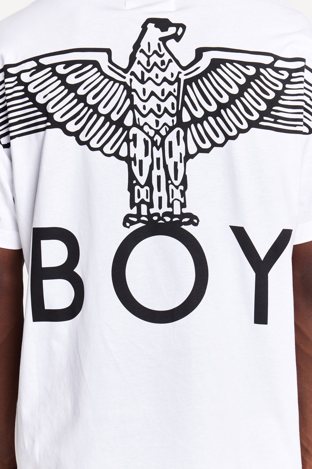 Model wearing White t-shirt with black eagle design and 'BOY' London text on a white background