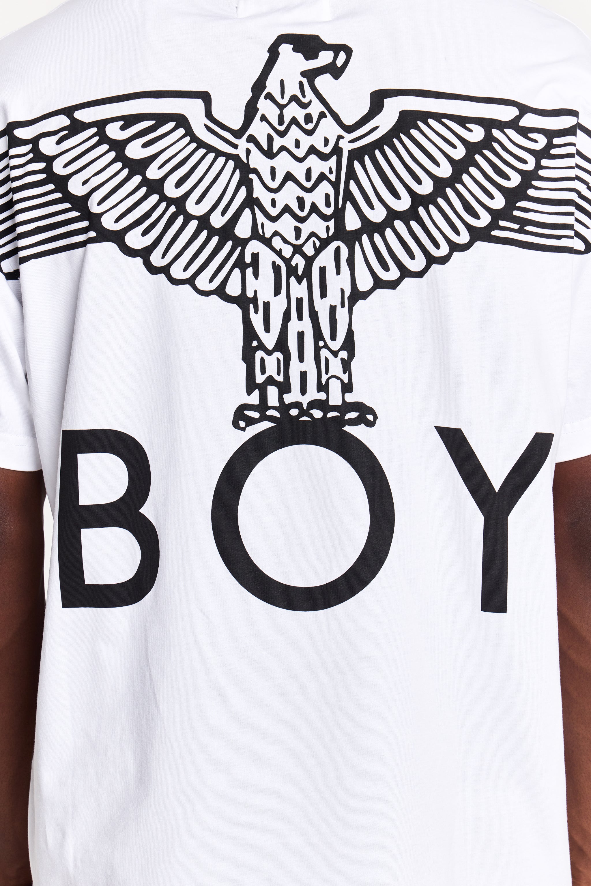 Model wearing White t-shirt with black eagle design and 'BOY' London text on a white background