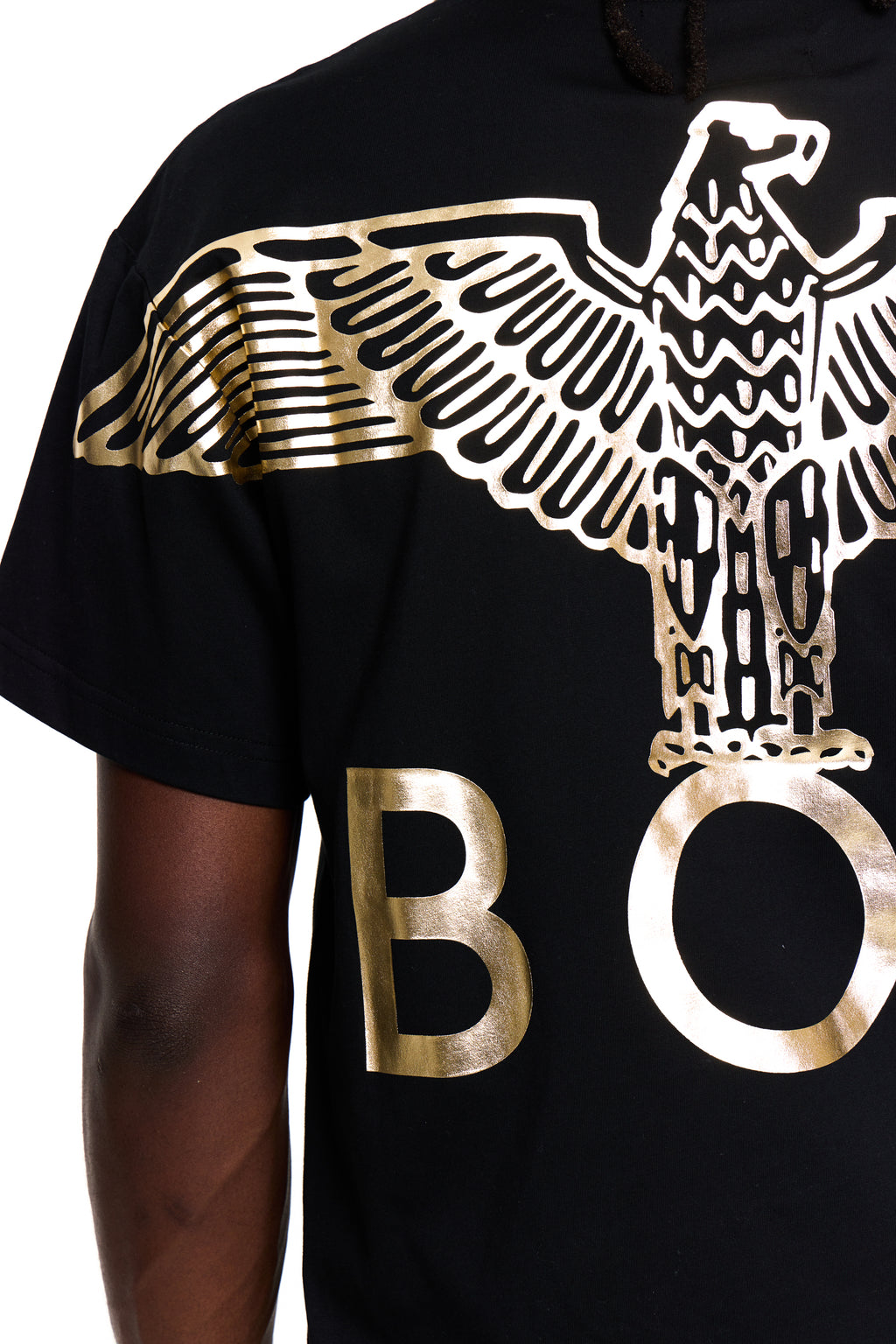 Black t-shirt with gold eagle design and 'BOY' letters on a white background