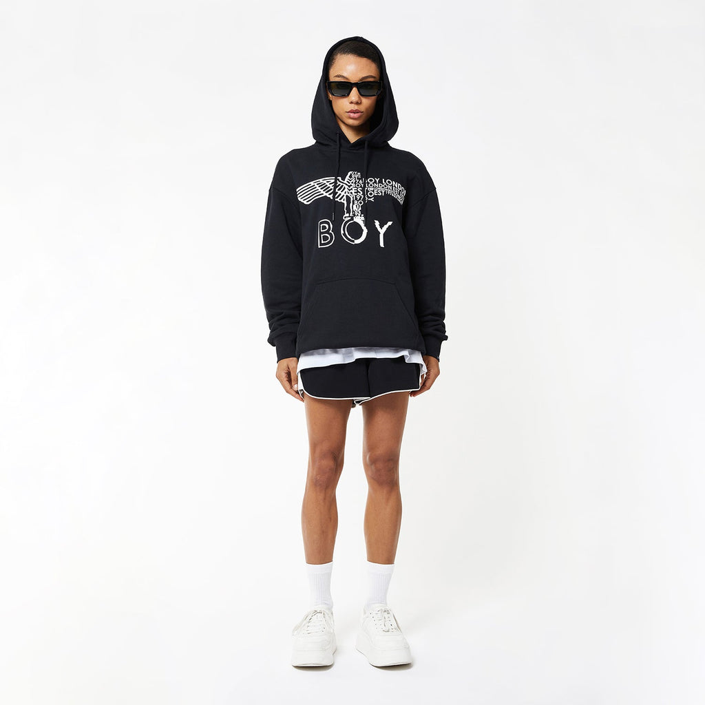 female model wearing Boy London eagle hoodie on white background 