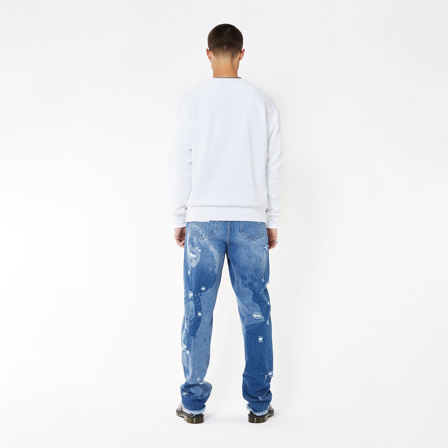 Model wearing BOY London sweatshirt on white background