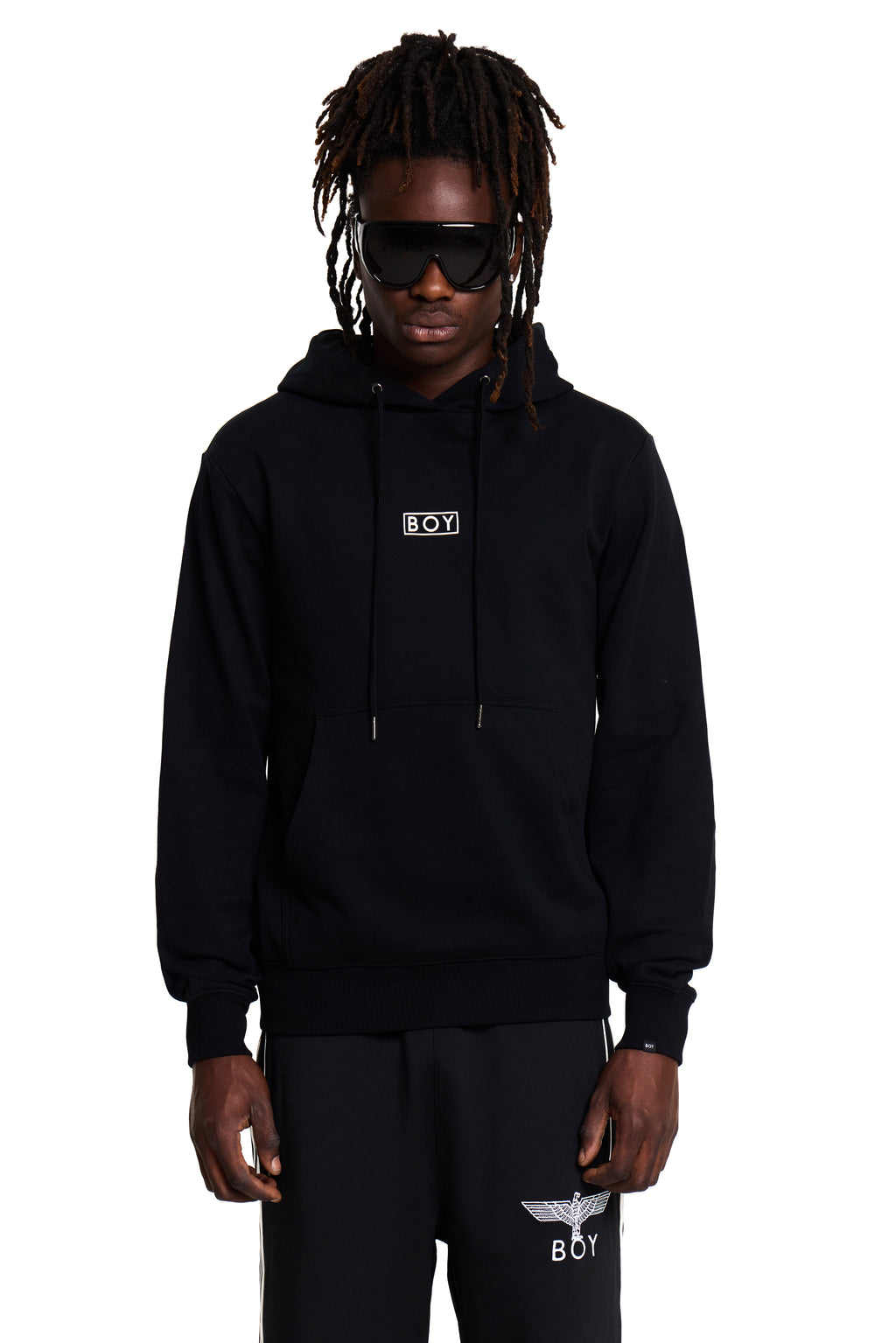 Model wearing a black BOY London hoodie with a logo on a white background