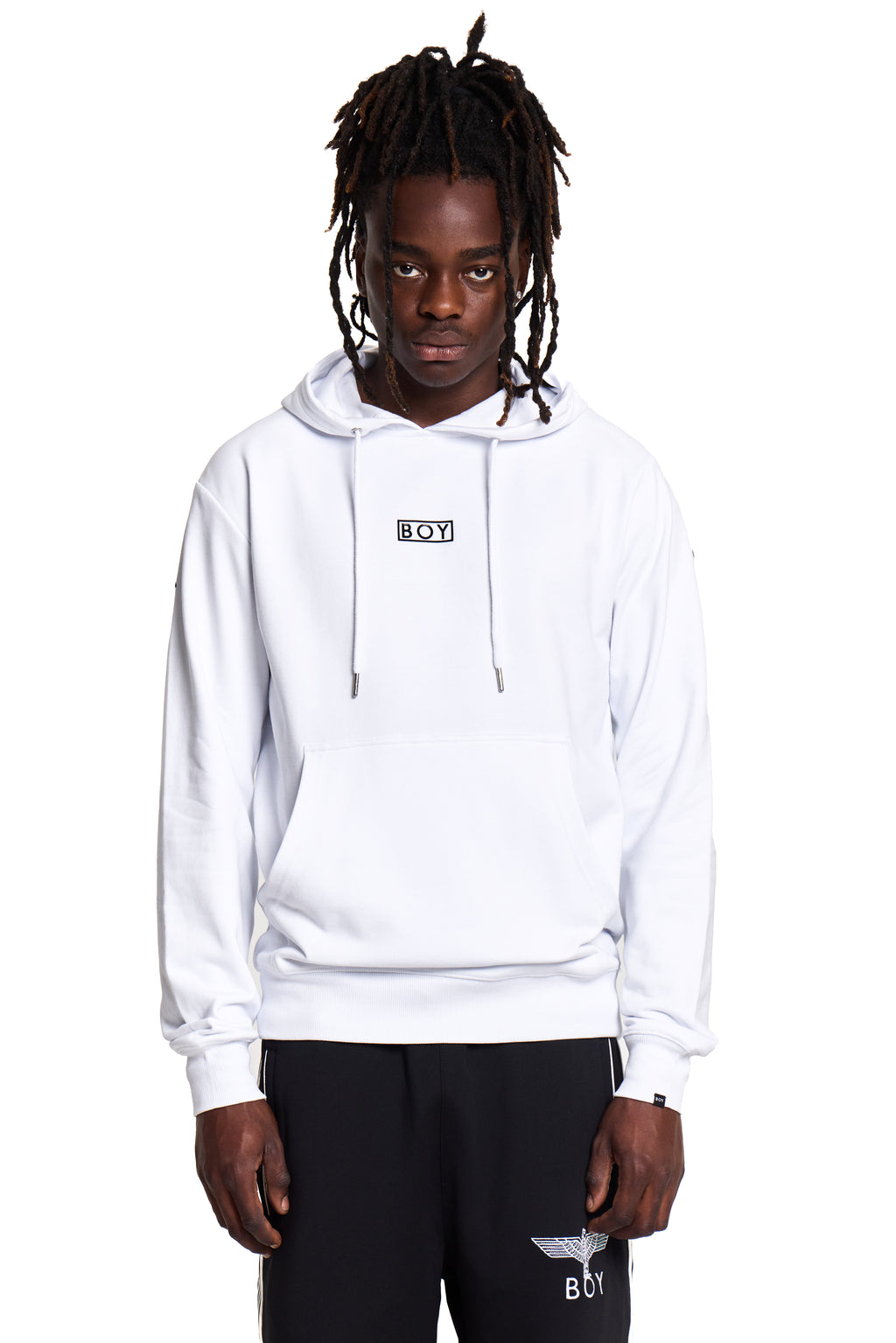 Model wearing a white BOY London hoodie with a brand logo on a white background