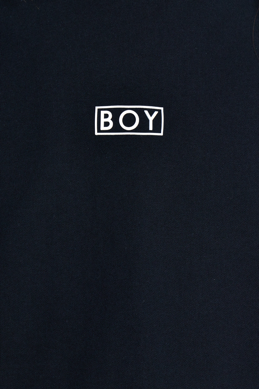 Black t-shirt with 'BOY' logo in white on a black background