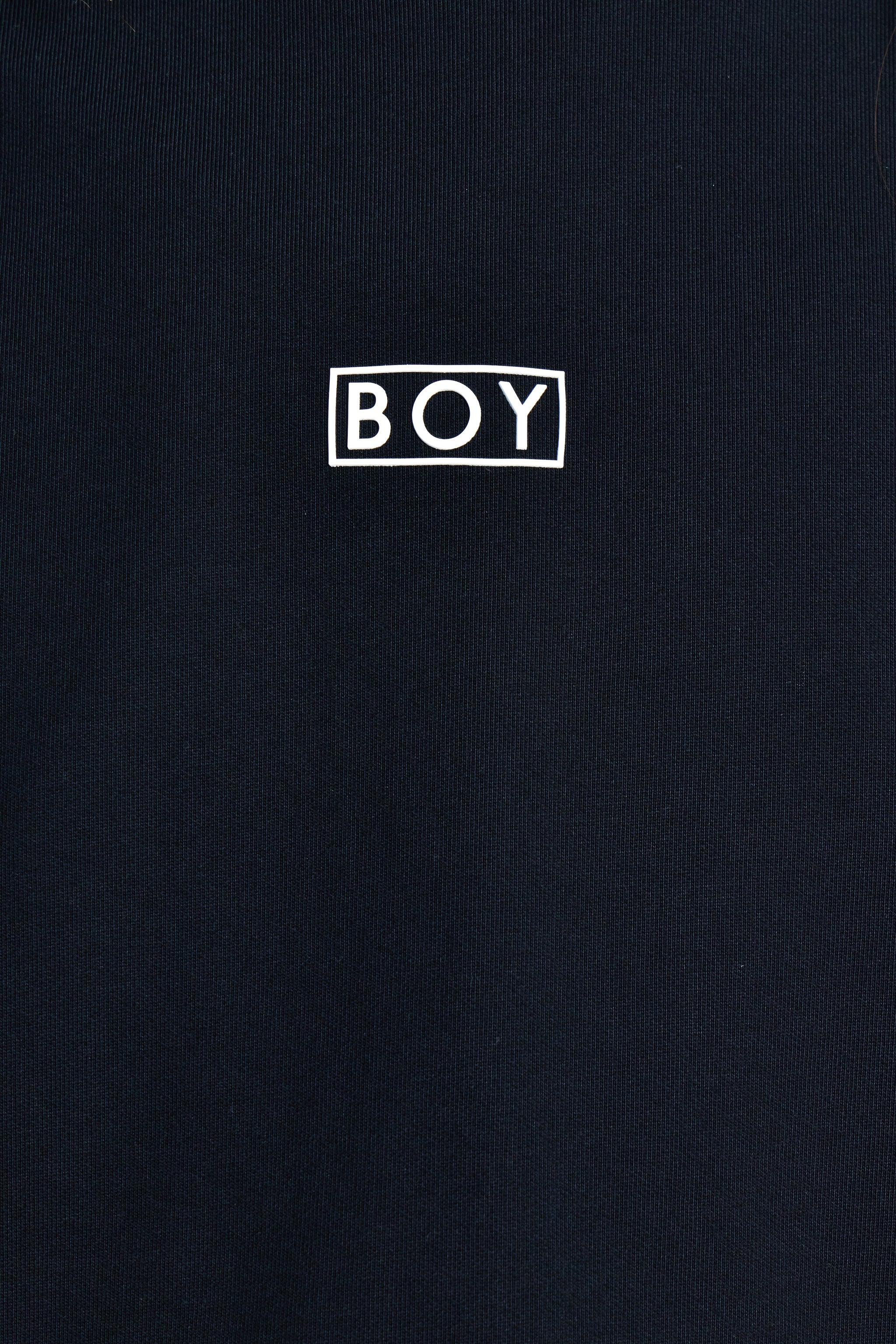 Black t-shirt with 'BOY' logo in white on a black background