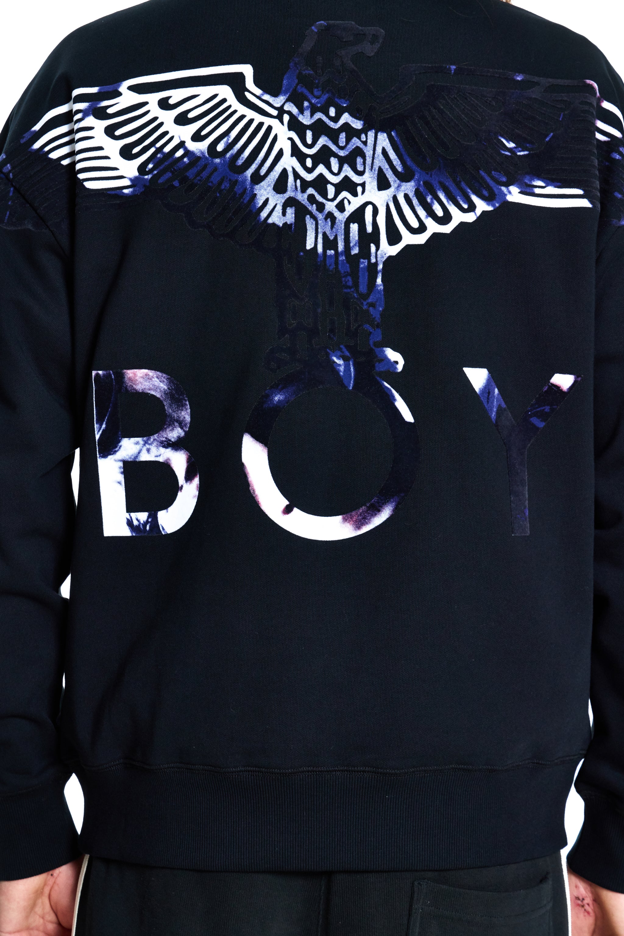 Black sweatshirt with white and blue eagle design and 'BOY' text on a black background
