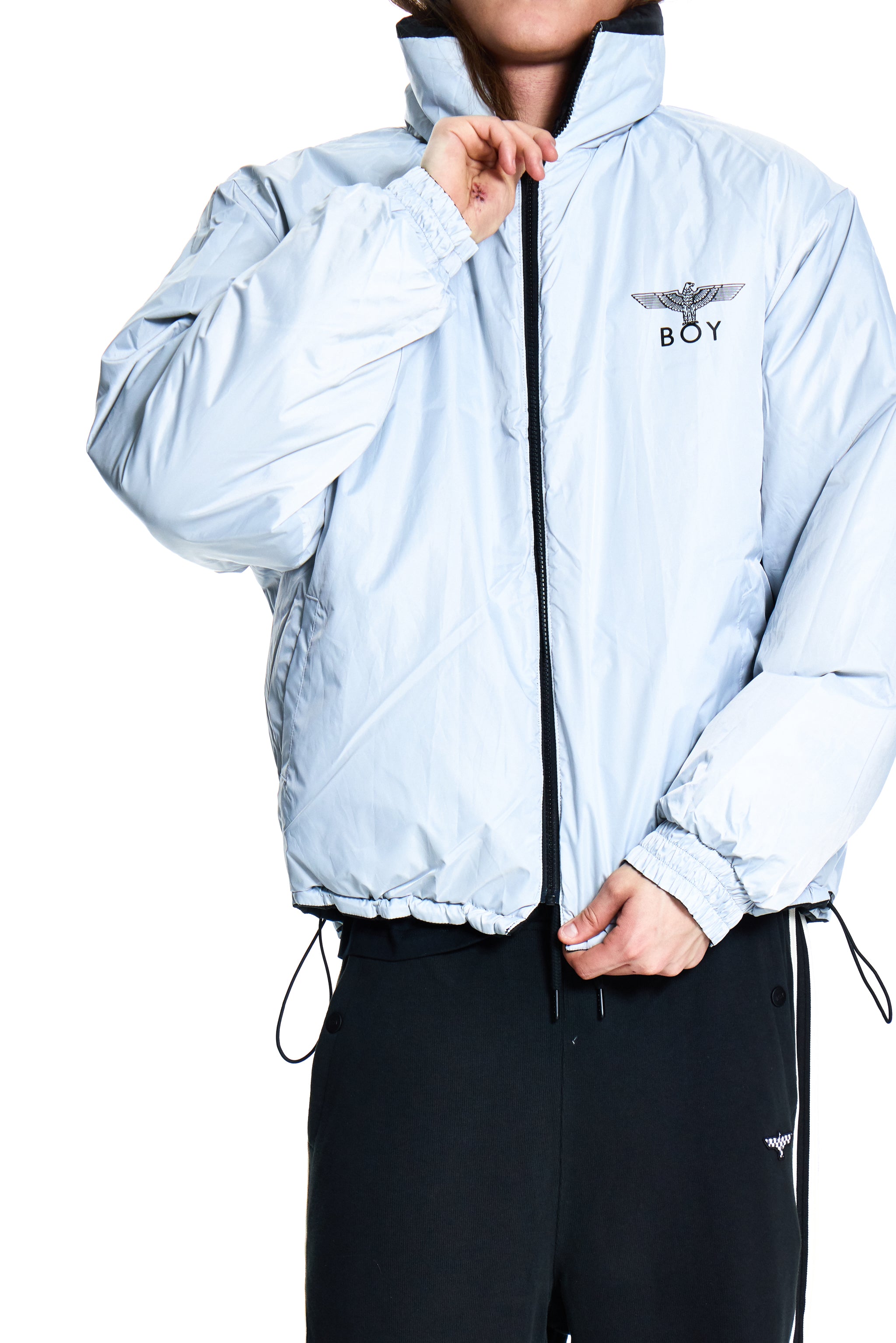 Light blue jacket with a brand logo worn by a person on a white background