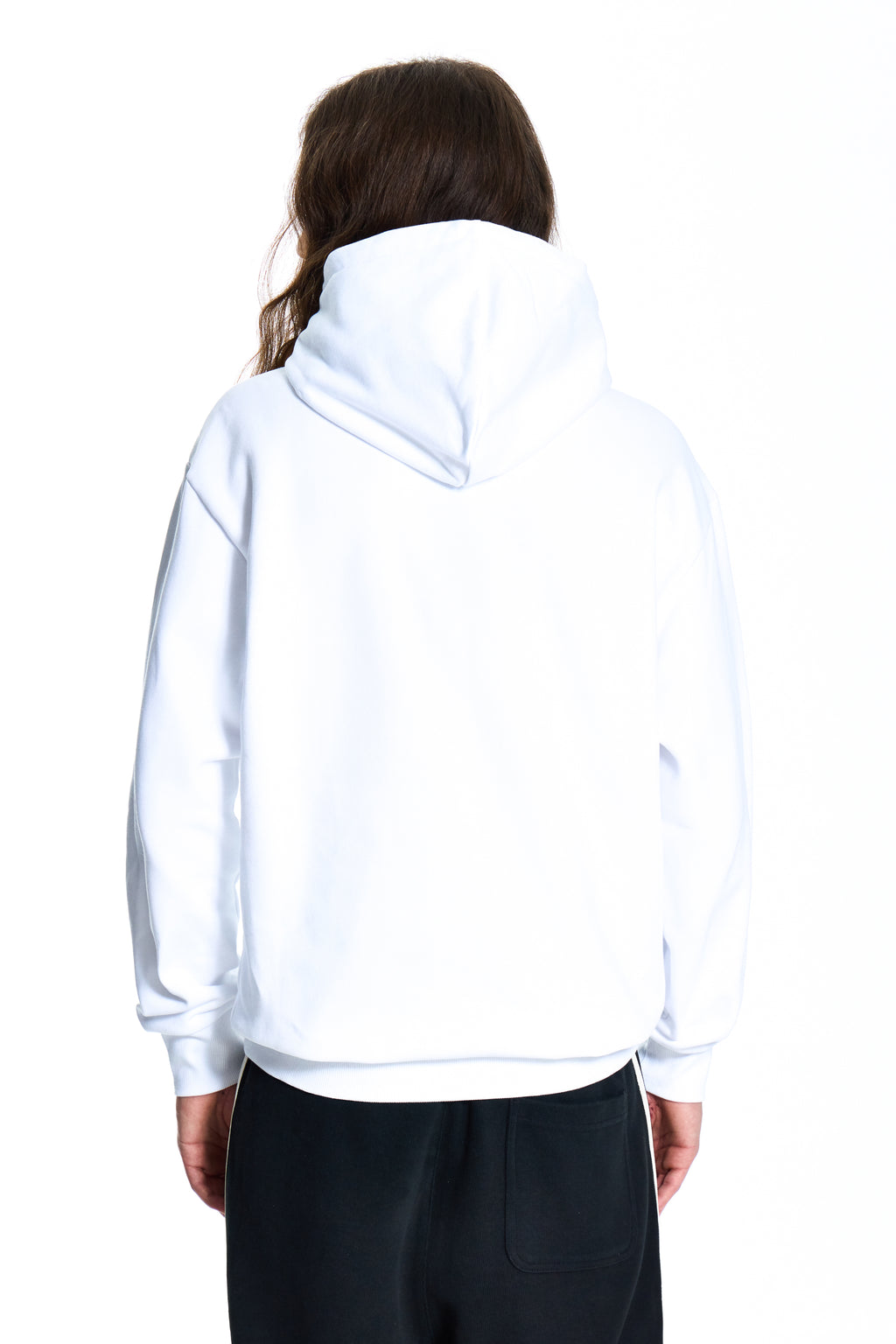 Person wearing a white hoodie on a white background