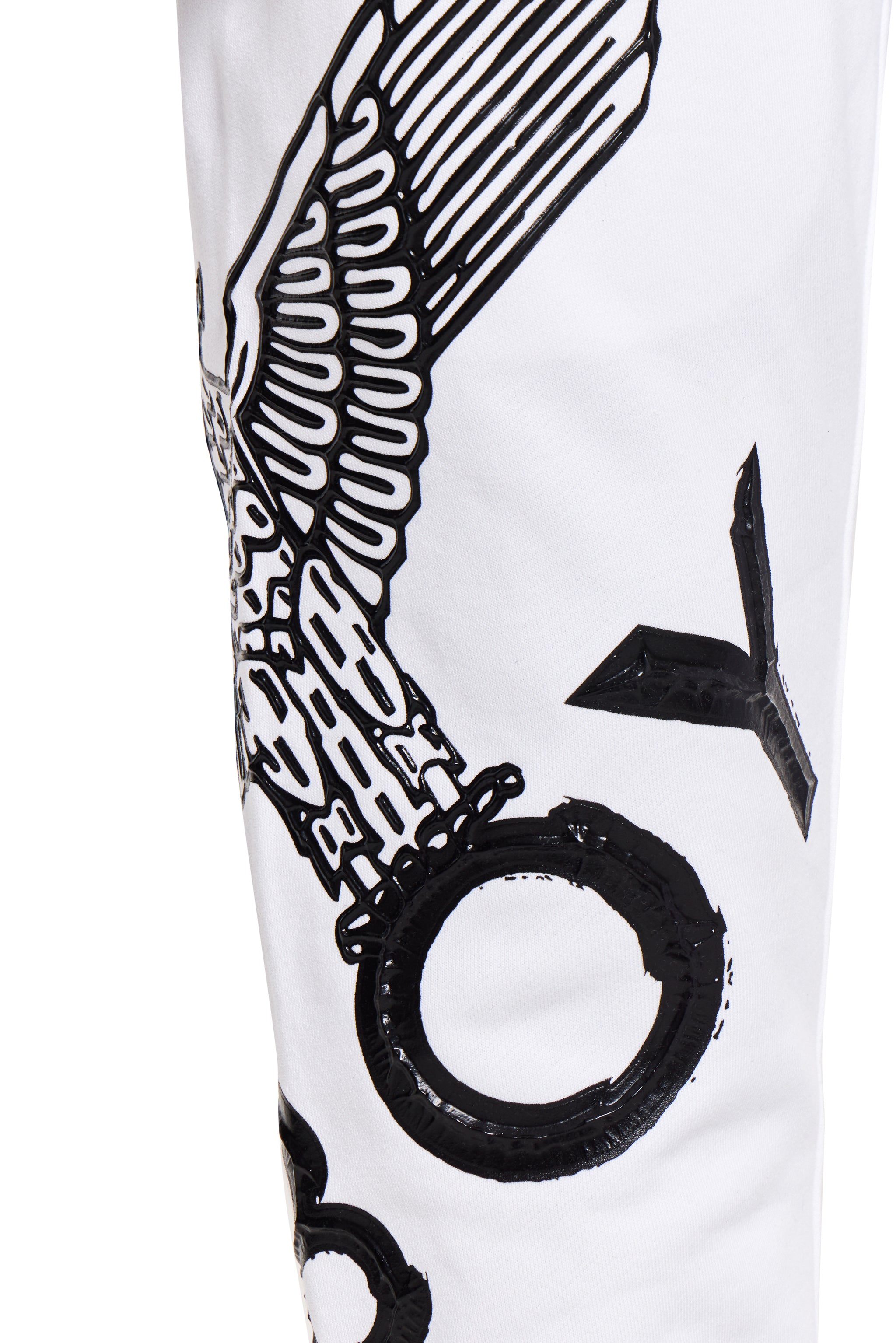 White BOY London shorts with black abstract designs on a white background