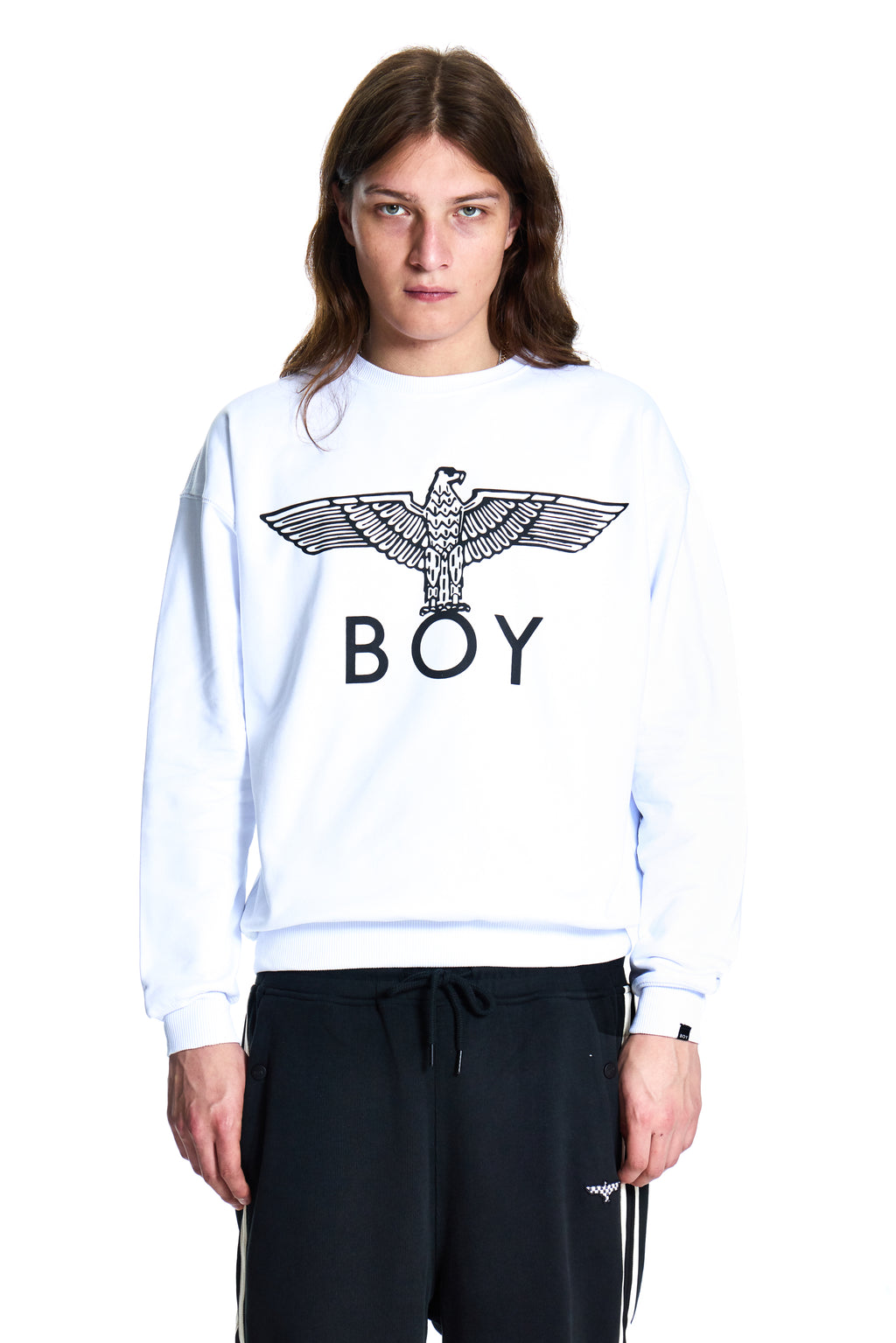 Person wearing a white sweatshirt with 'BOY' and an eagle logo on a white background