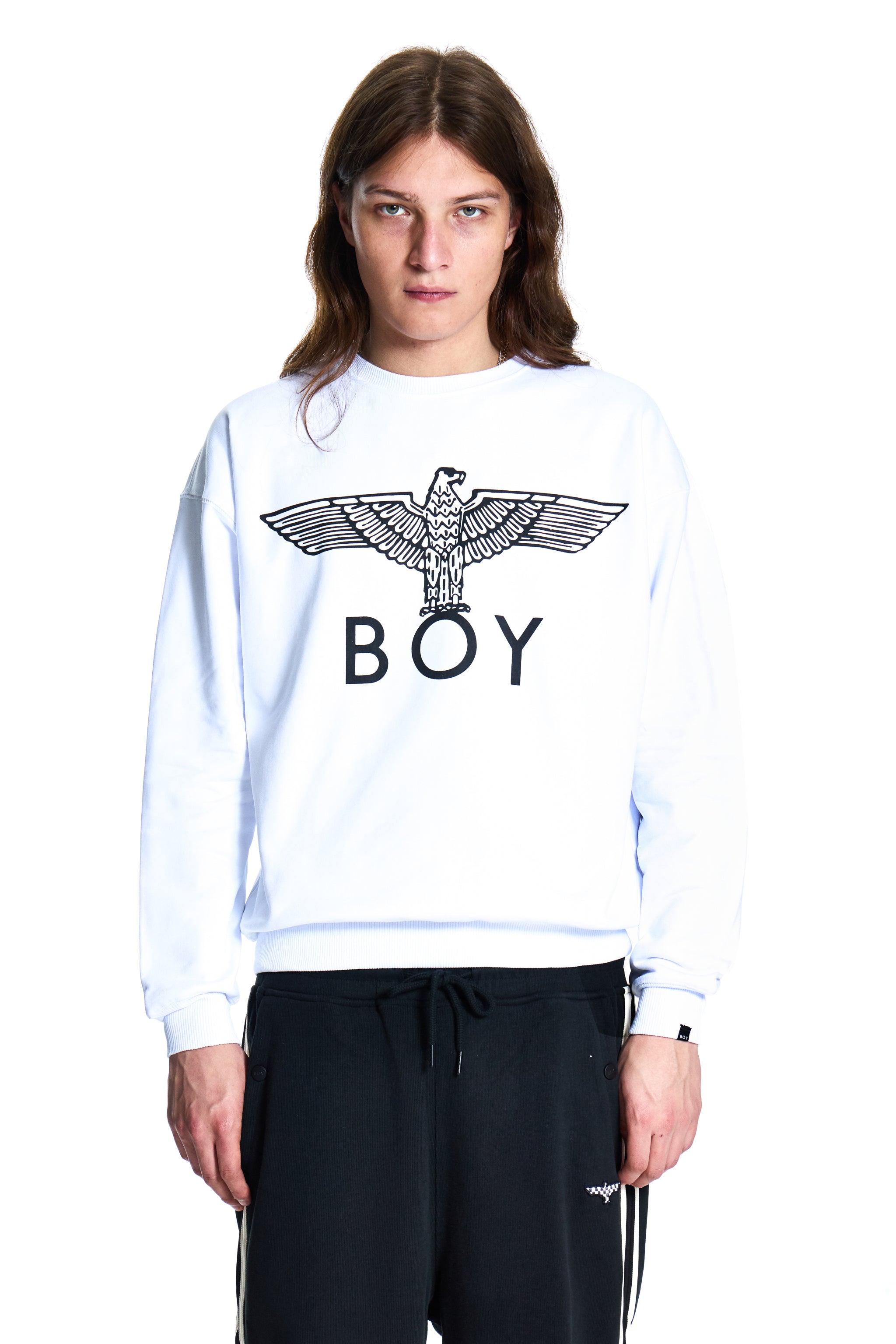 Person wearing a white sweatshirt with 'BOY' and an eagle logo on a white background