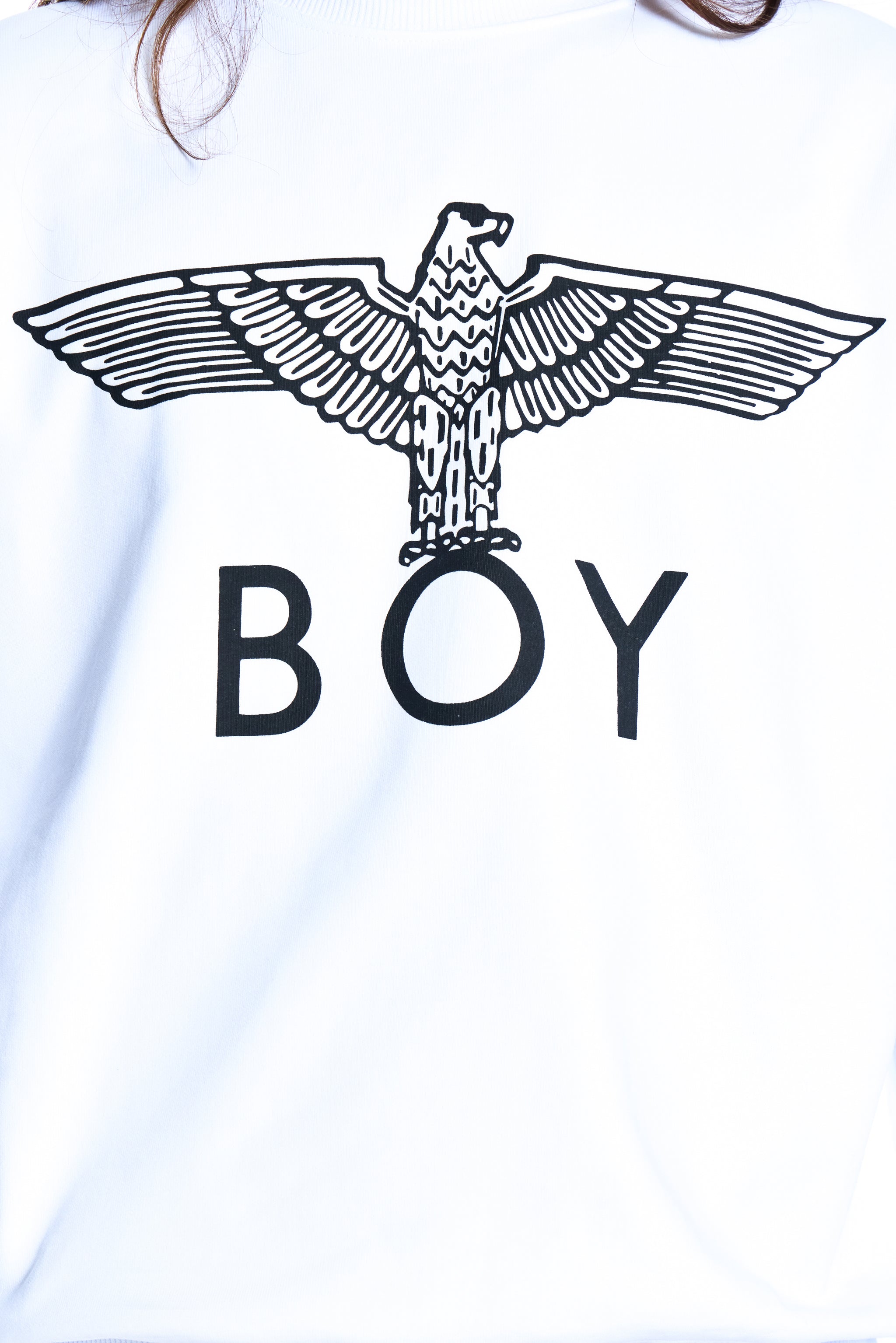 White t-shirt with black eagle graphic and 'BOY' text on a white background